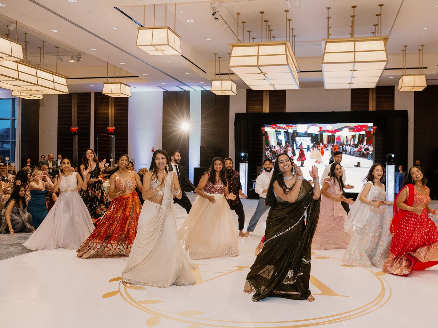 Wedding guests dancing in the Rose Kennedy Ballroom.