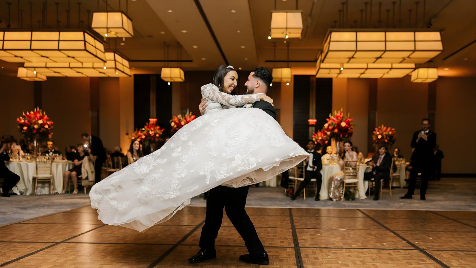 Bride and groom embracing in the dance floor