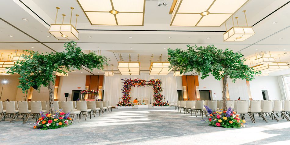 IC Boston wedding space with floral arch and aisle 
