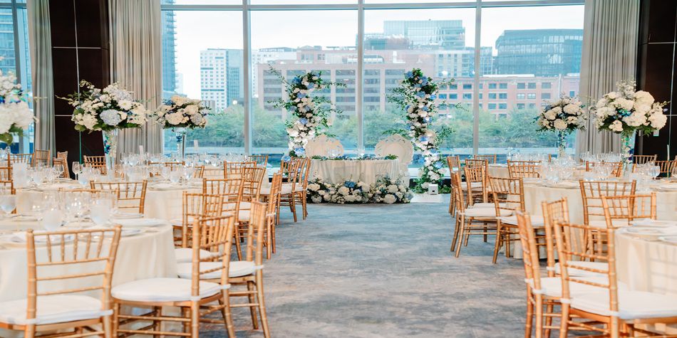IC Boston wedding space with guest tables and white florals
