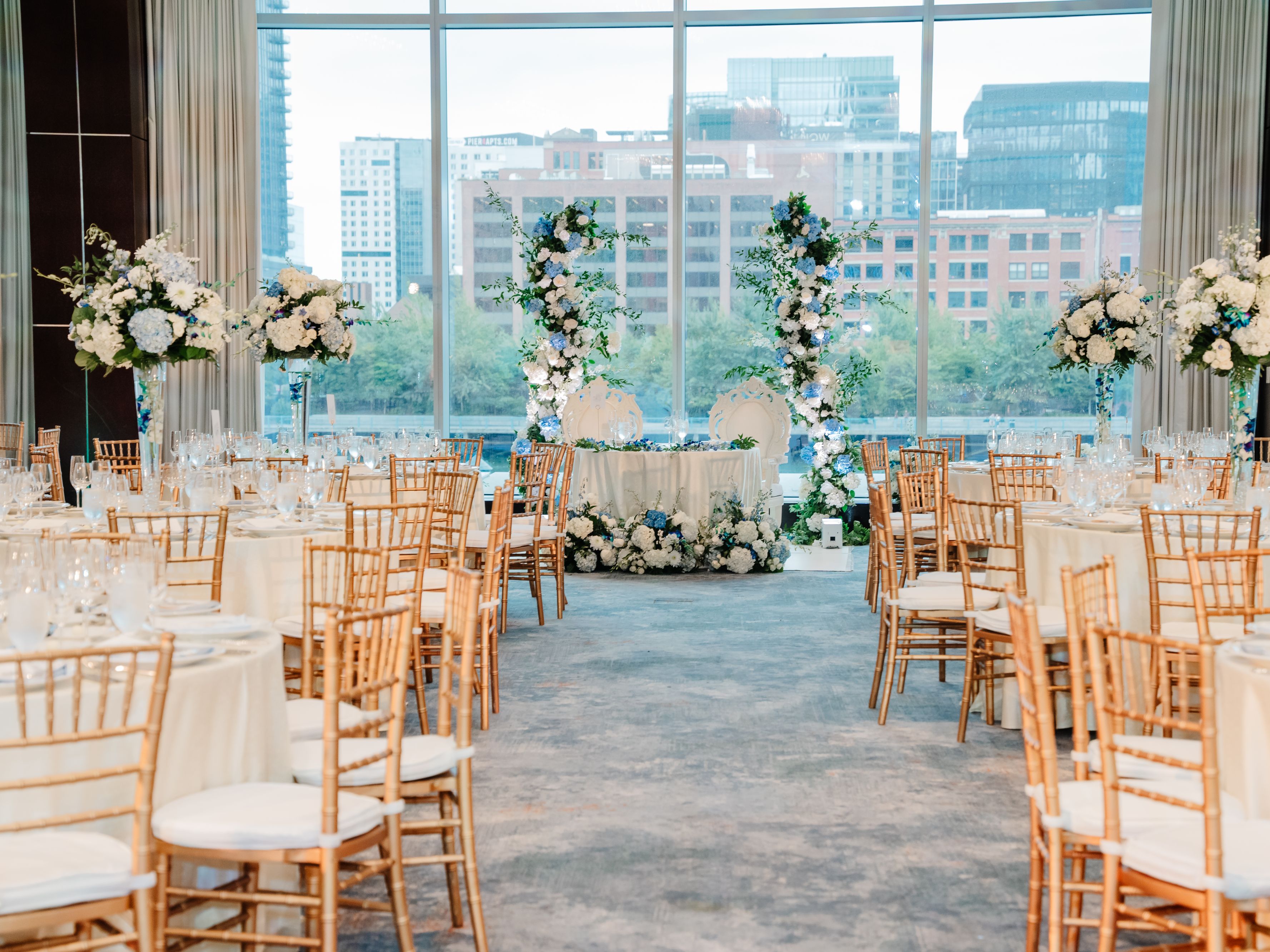 Wedding tables set up with florals and decor in the Abigail Adams Ballroom.