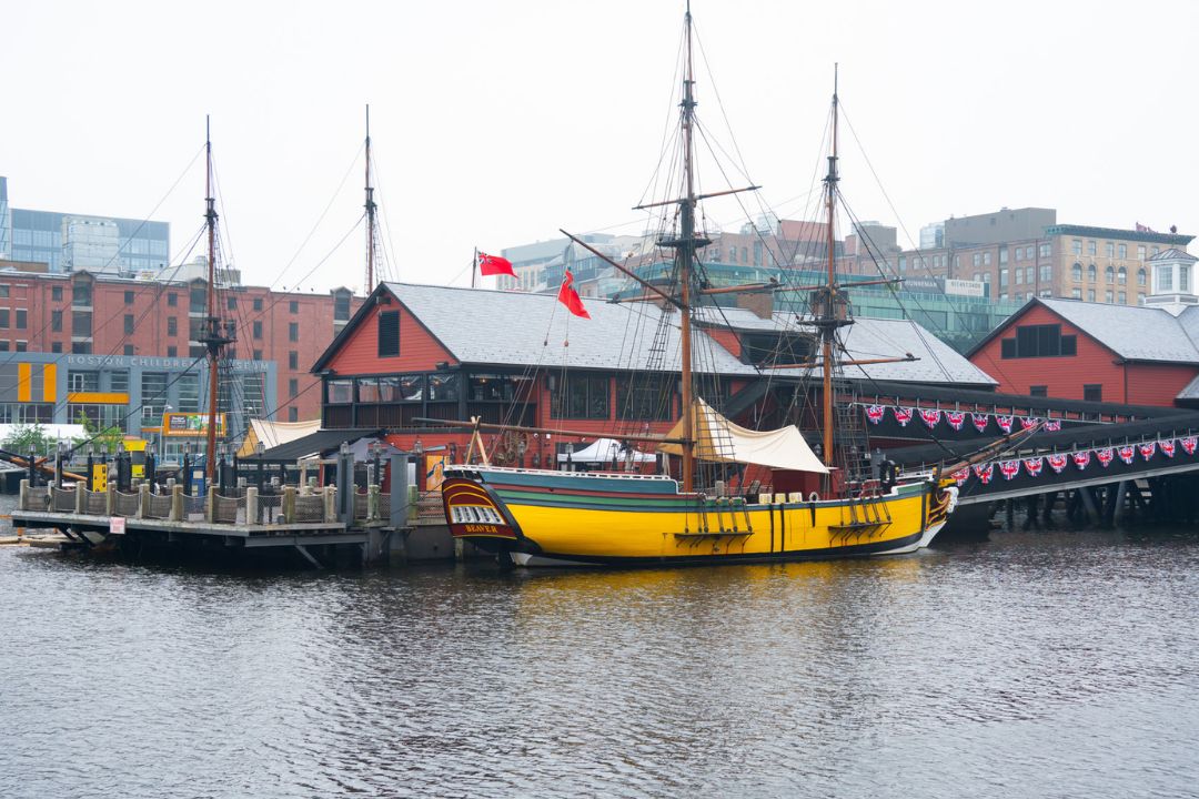 Yellow pirate boat sitting by the dock in Boston Harbor.
