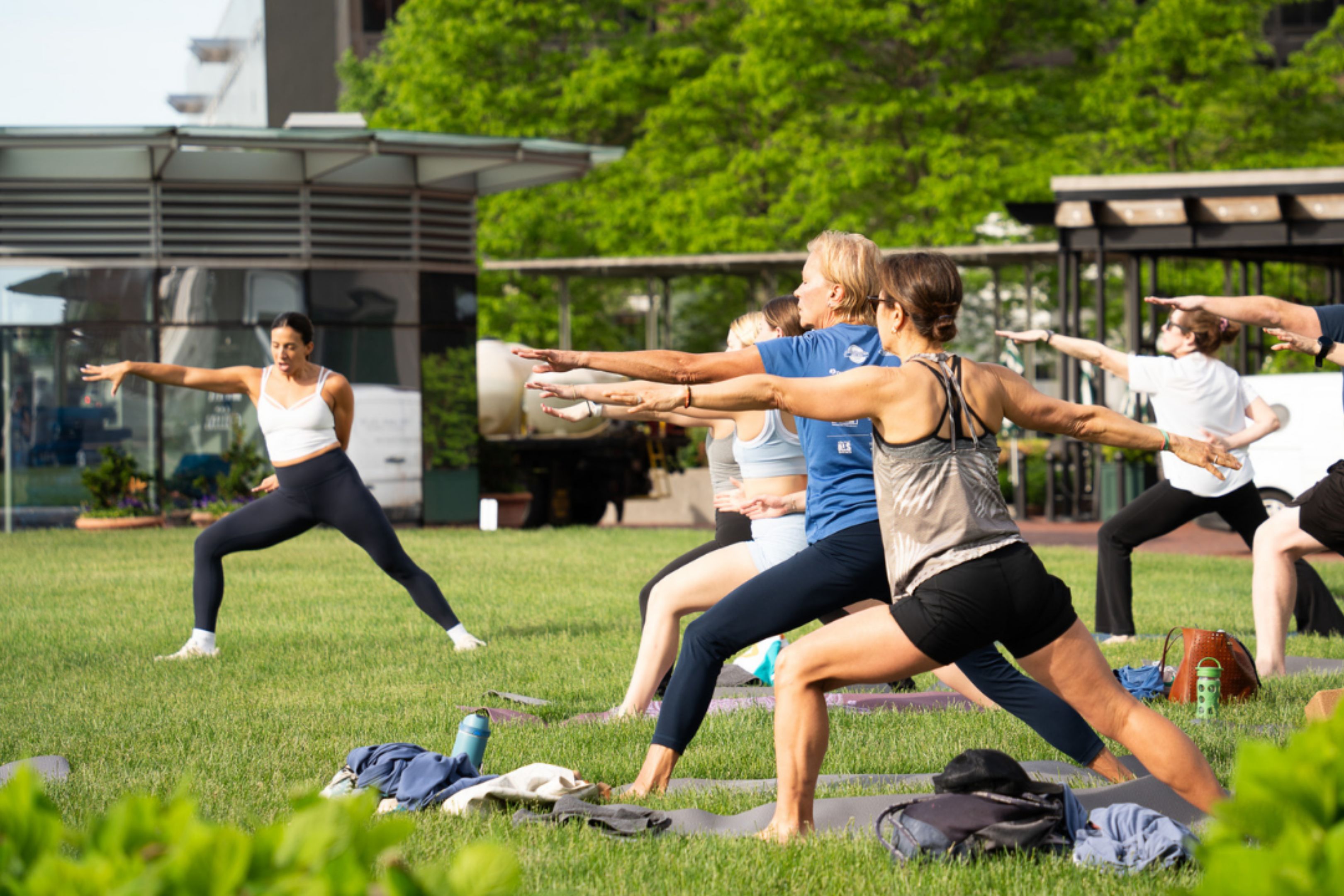 Yoga instructor, Jessica, guiding the guests in a lunge yoga pose.