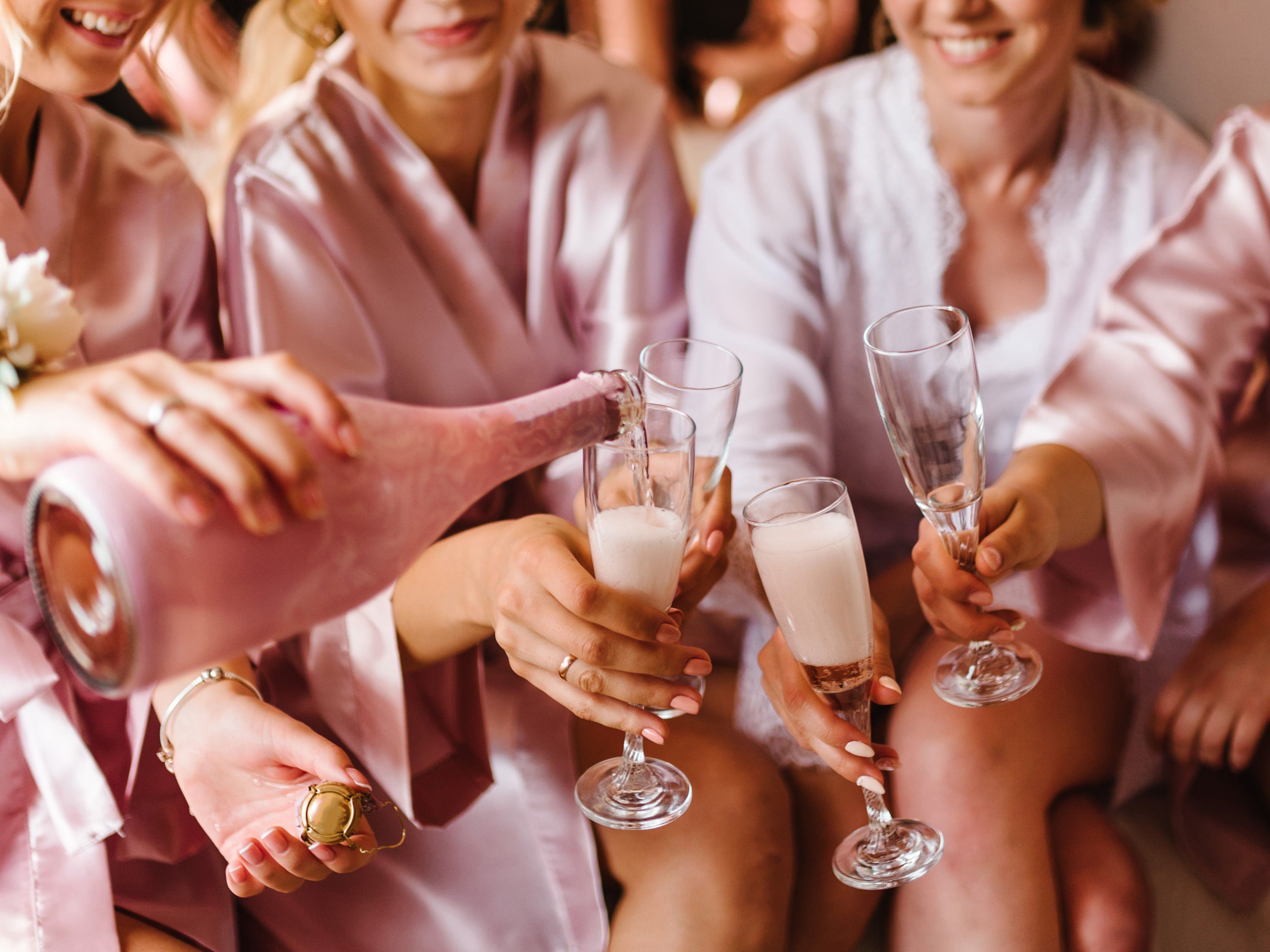 Bridal party drinking champagne