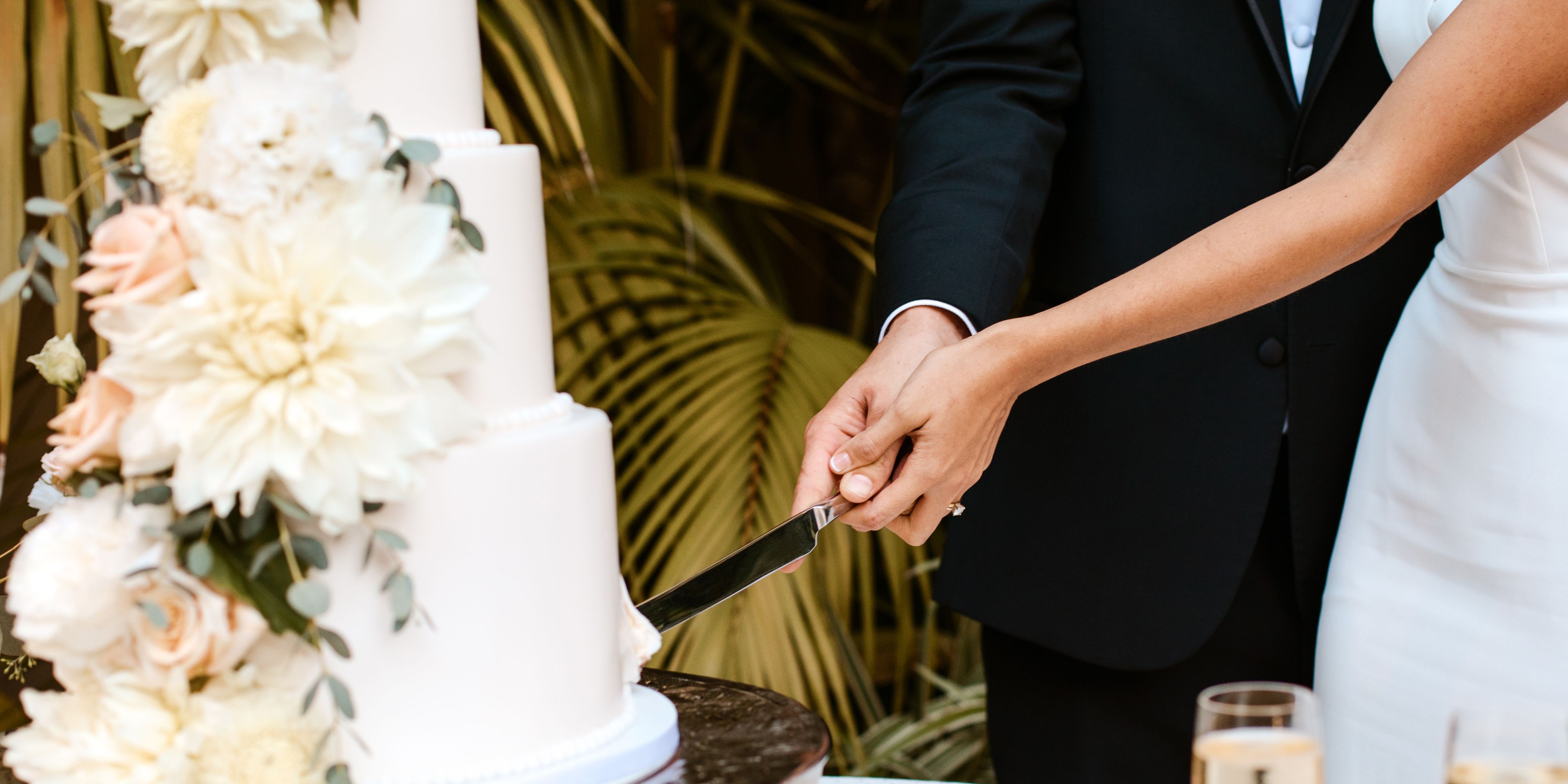 Bride and groom cutting a wedding cake.