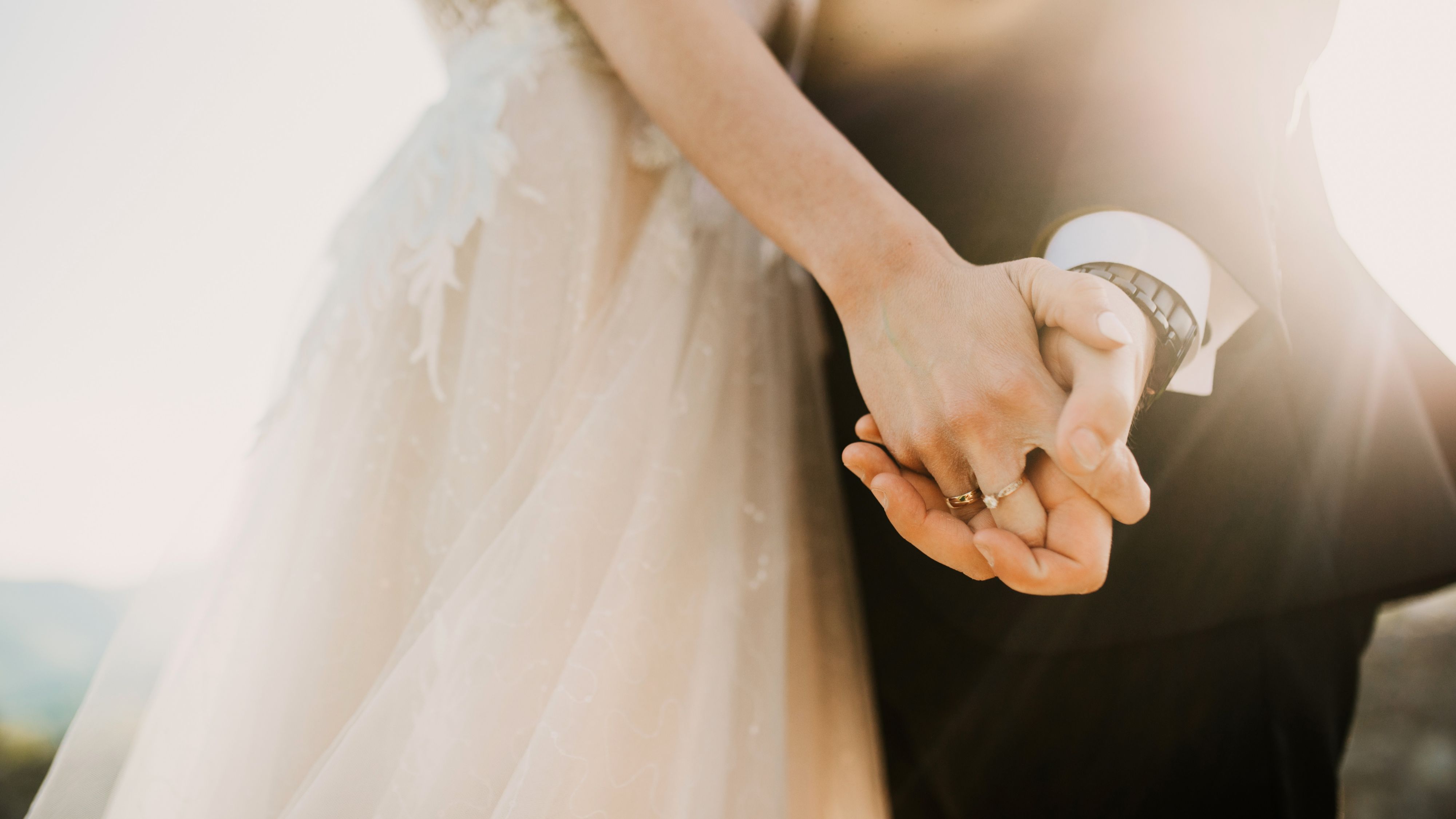 Wedding couple holding hands