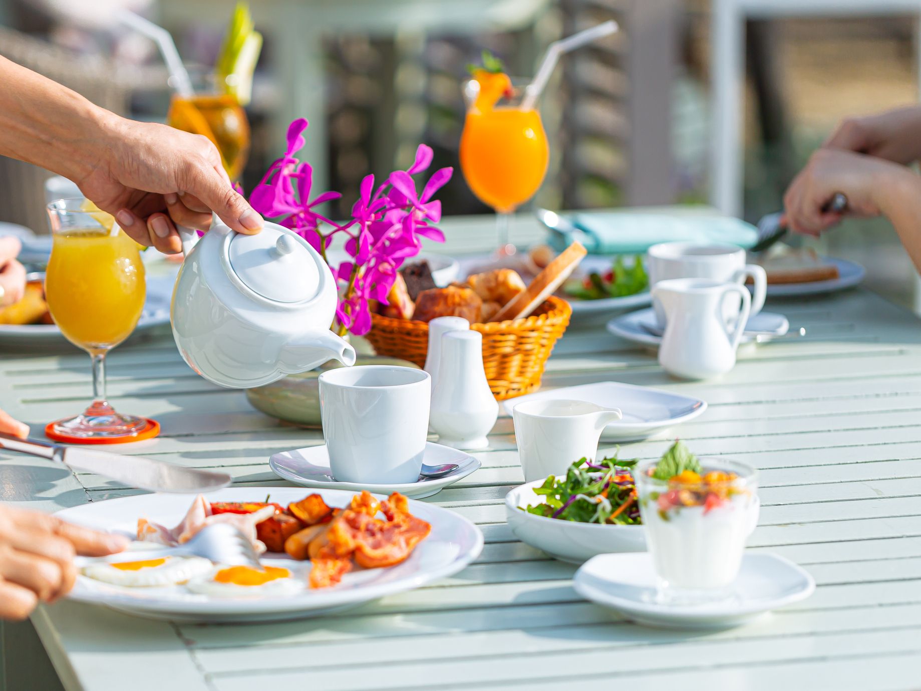 Having breakfast and pouring tea