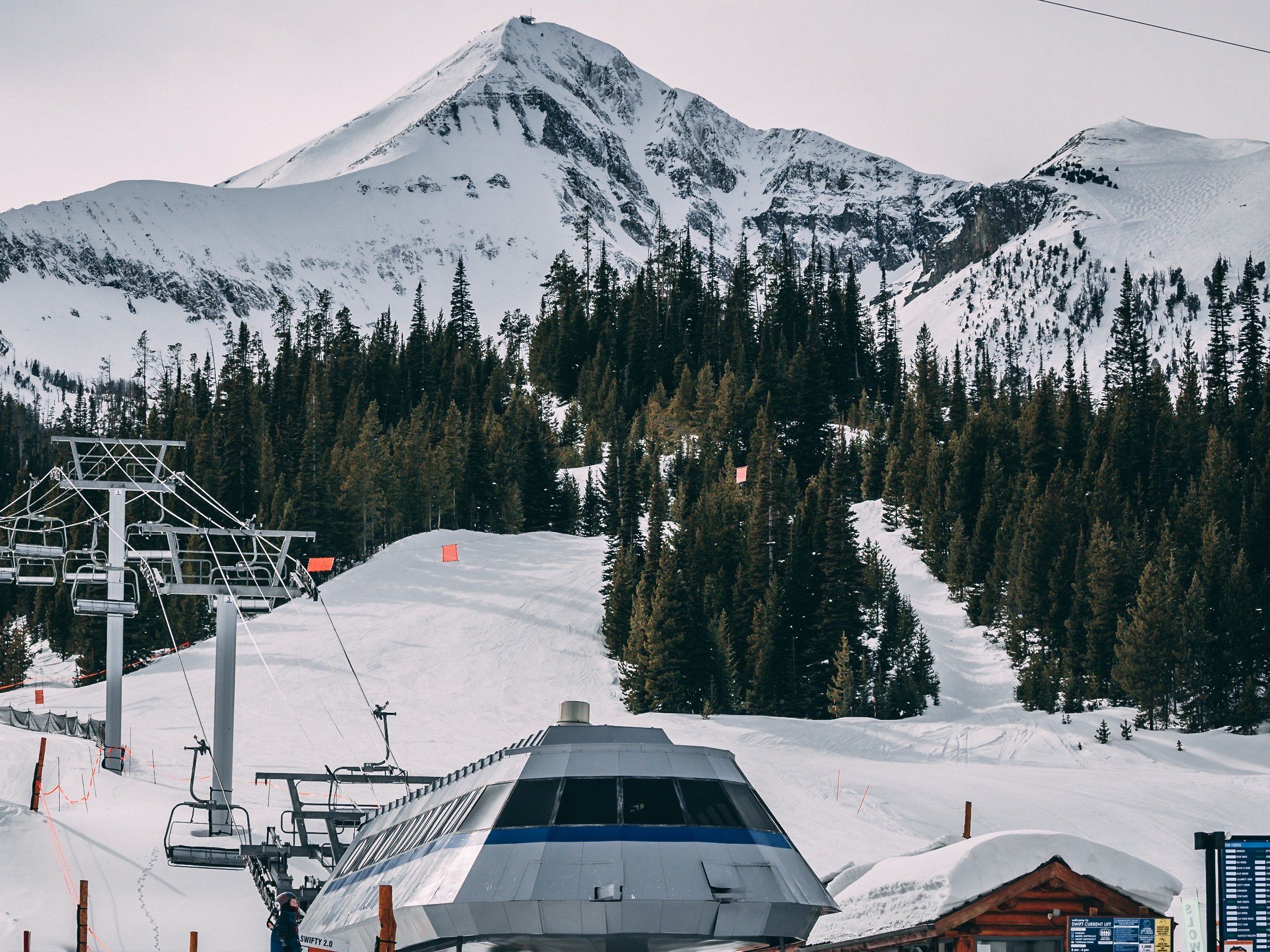 Big Sky mountain range with a ski lift in the foreground