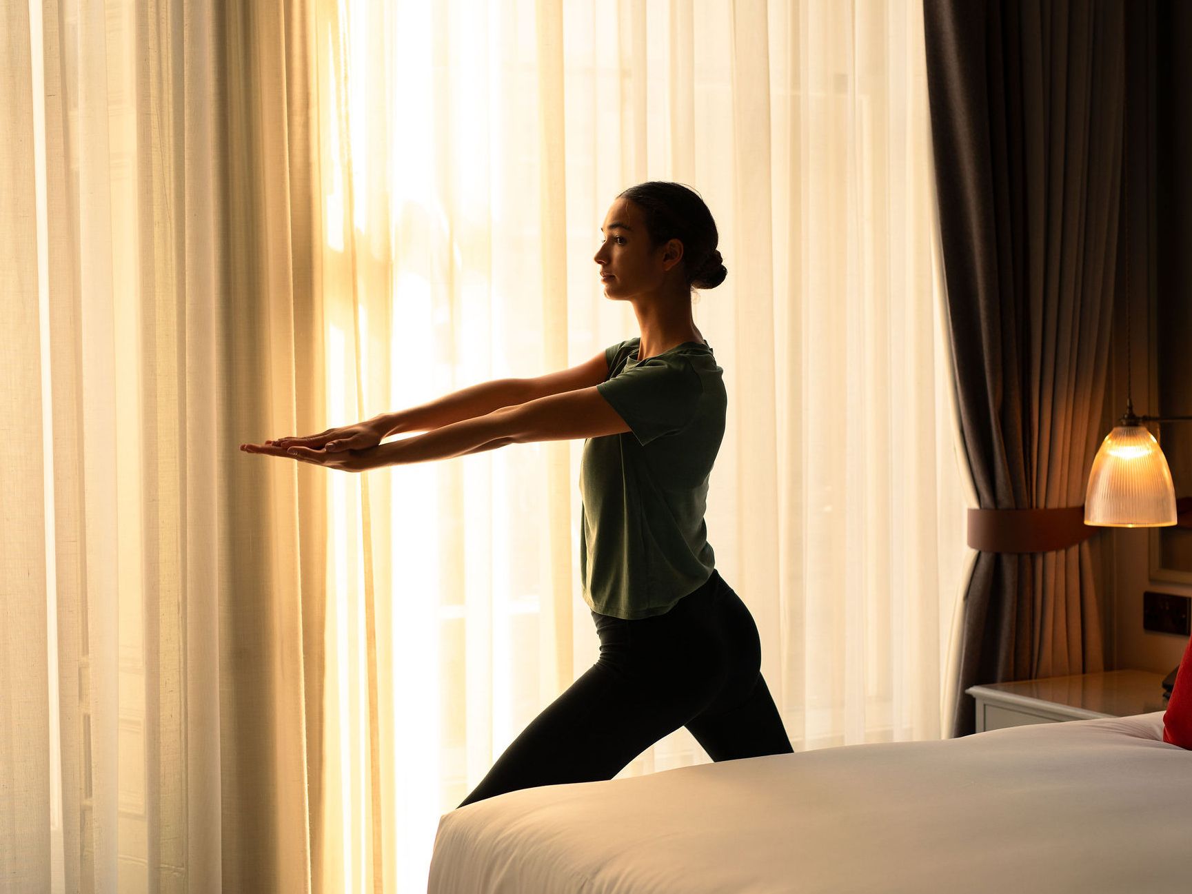 Guest doing yoga in suite