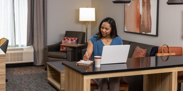 Hotel guest working in suite