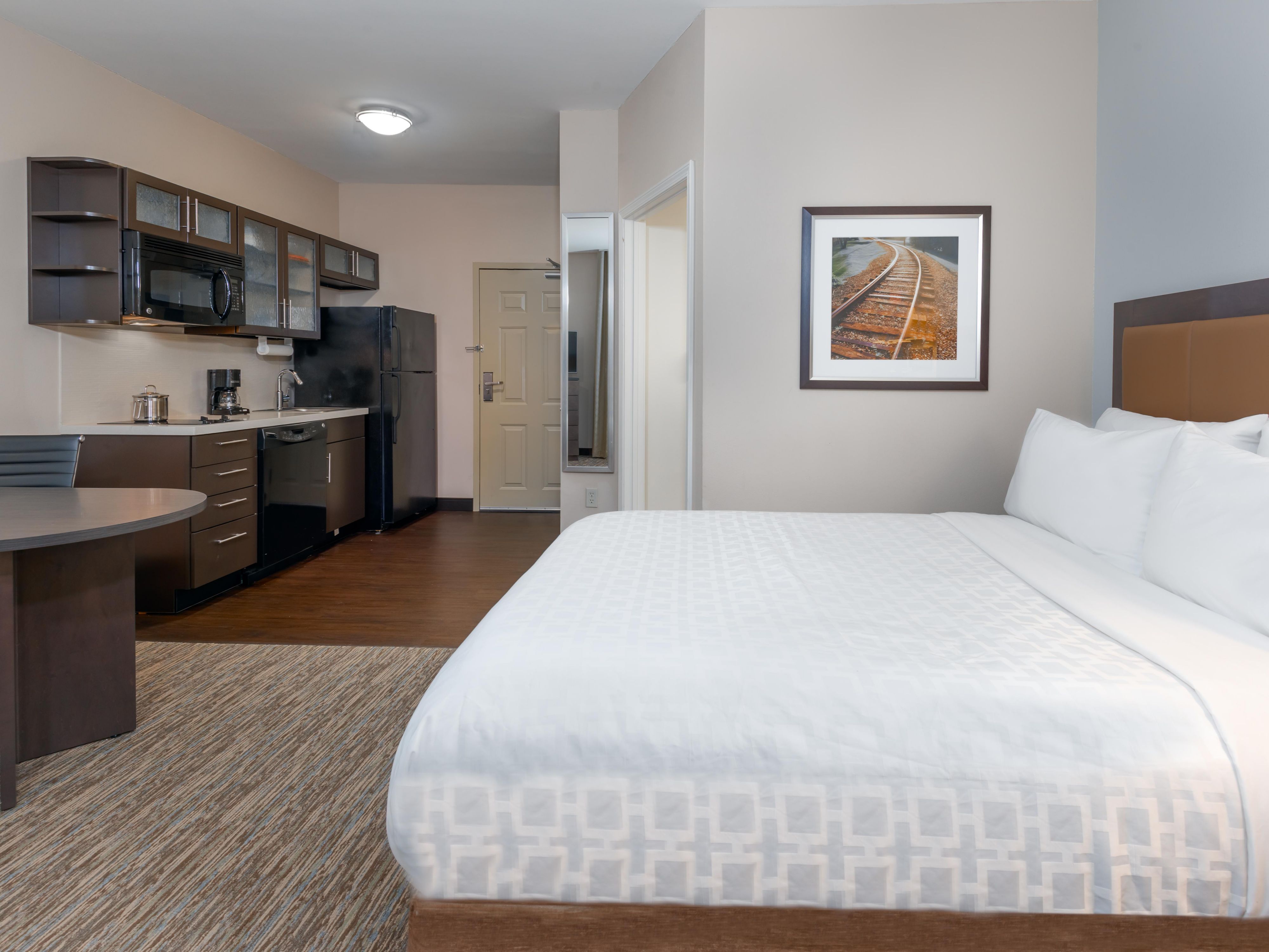 Make yourself at home in our queen bed suites equipped kitchens