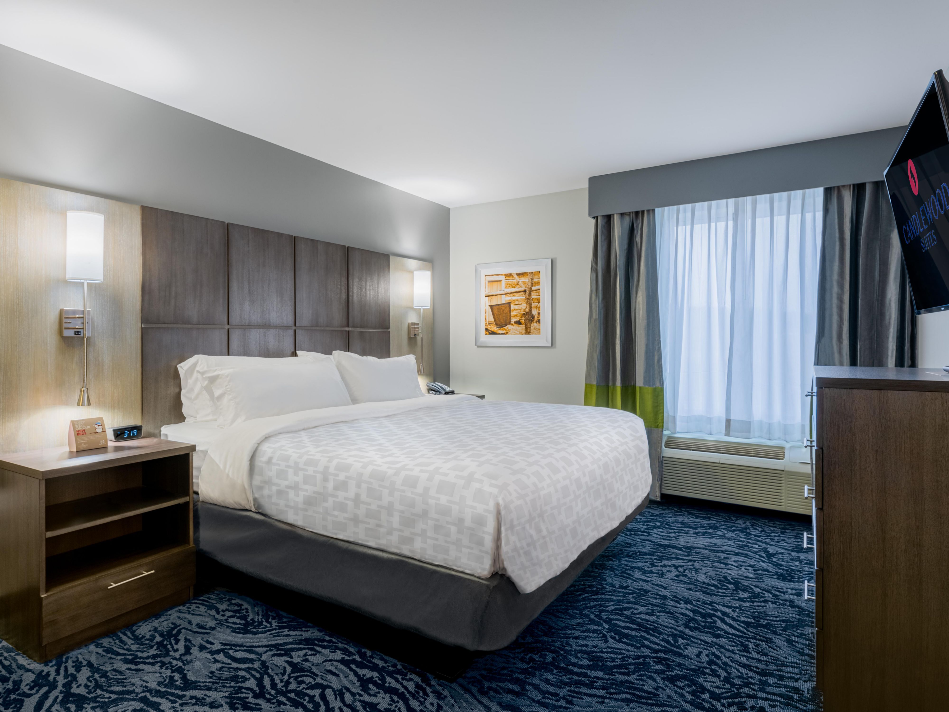Snuggle up with plush bedding in our One King bed room.