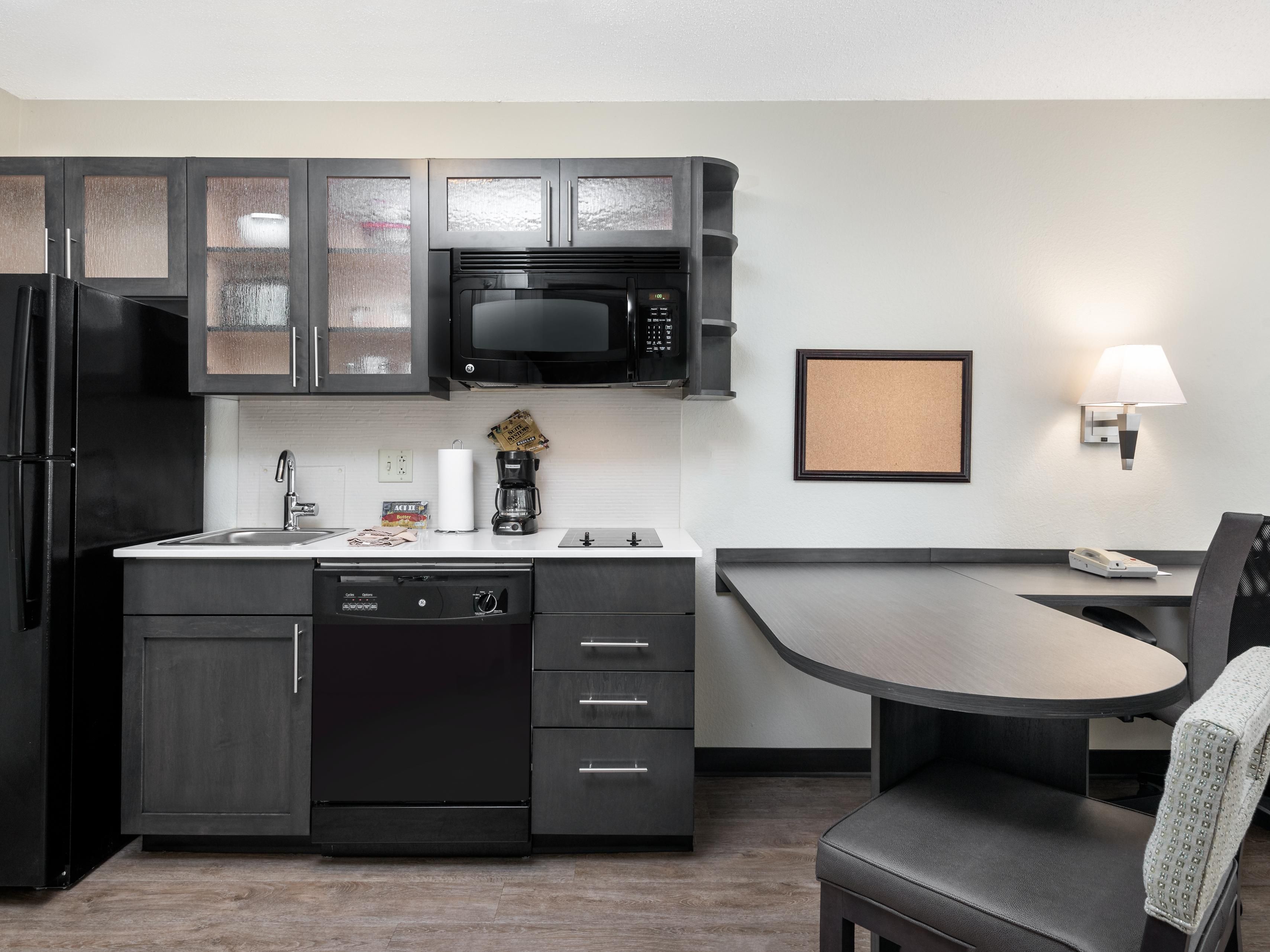 All guestrooms have fully equipped kitchens. 2 burner stove top, Full size refrigerator, dishwasher, microwave and coffee maker. Kitchen is also supplied with all the plates, utensils, and cookware that you will need.