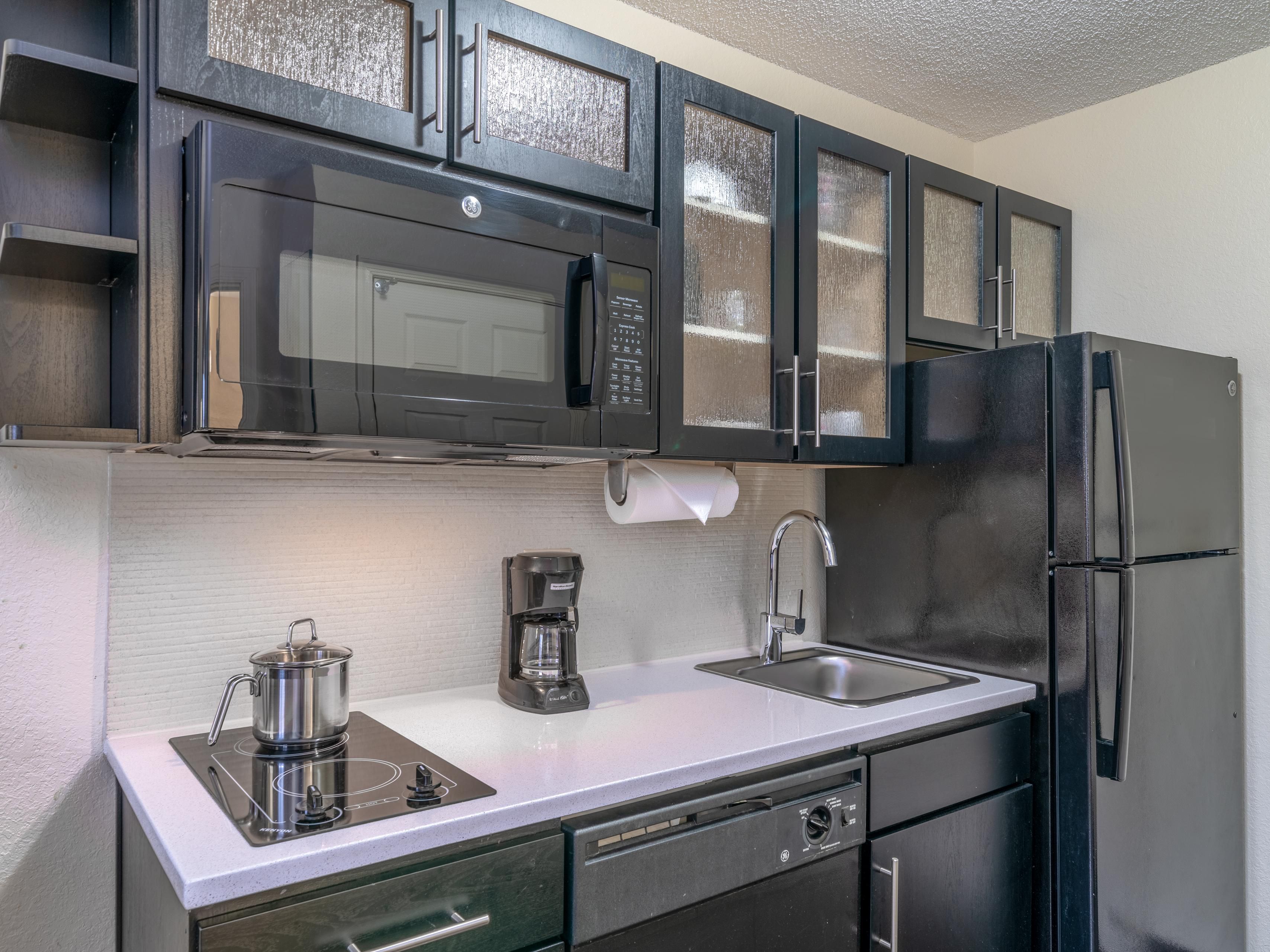 All guestrooms have fully equipped kitchens. Two burner stove top, full sized refrigerator, dishwasher, microwave and coffeemaker. The kitchen is also supplied with all the plates, glasses, utensils, and cookware that you will need.