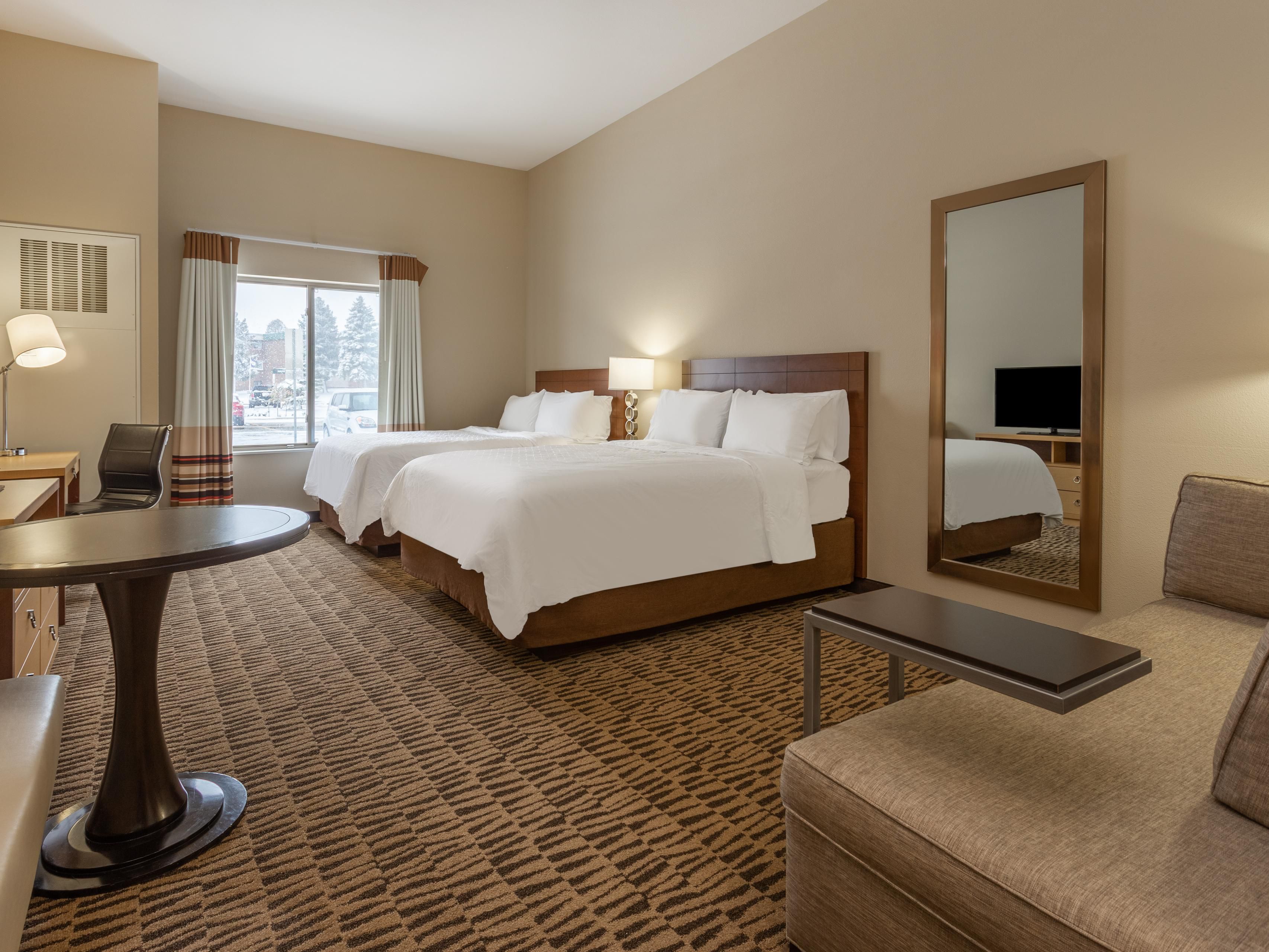 Two Queen Sized Beds, Chaise Lounger, Fully Equipped Kitchenette.