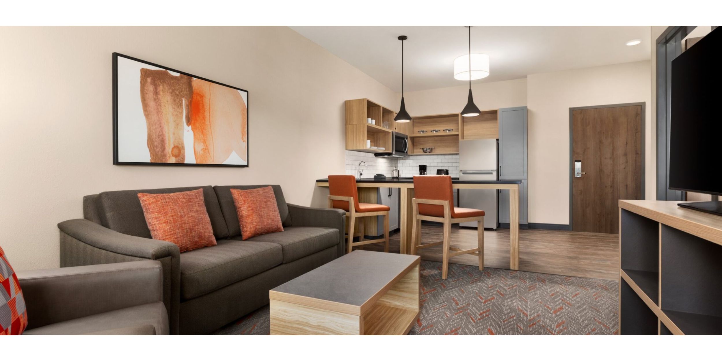A guest suite featuring a living room and kitchen