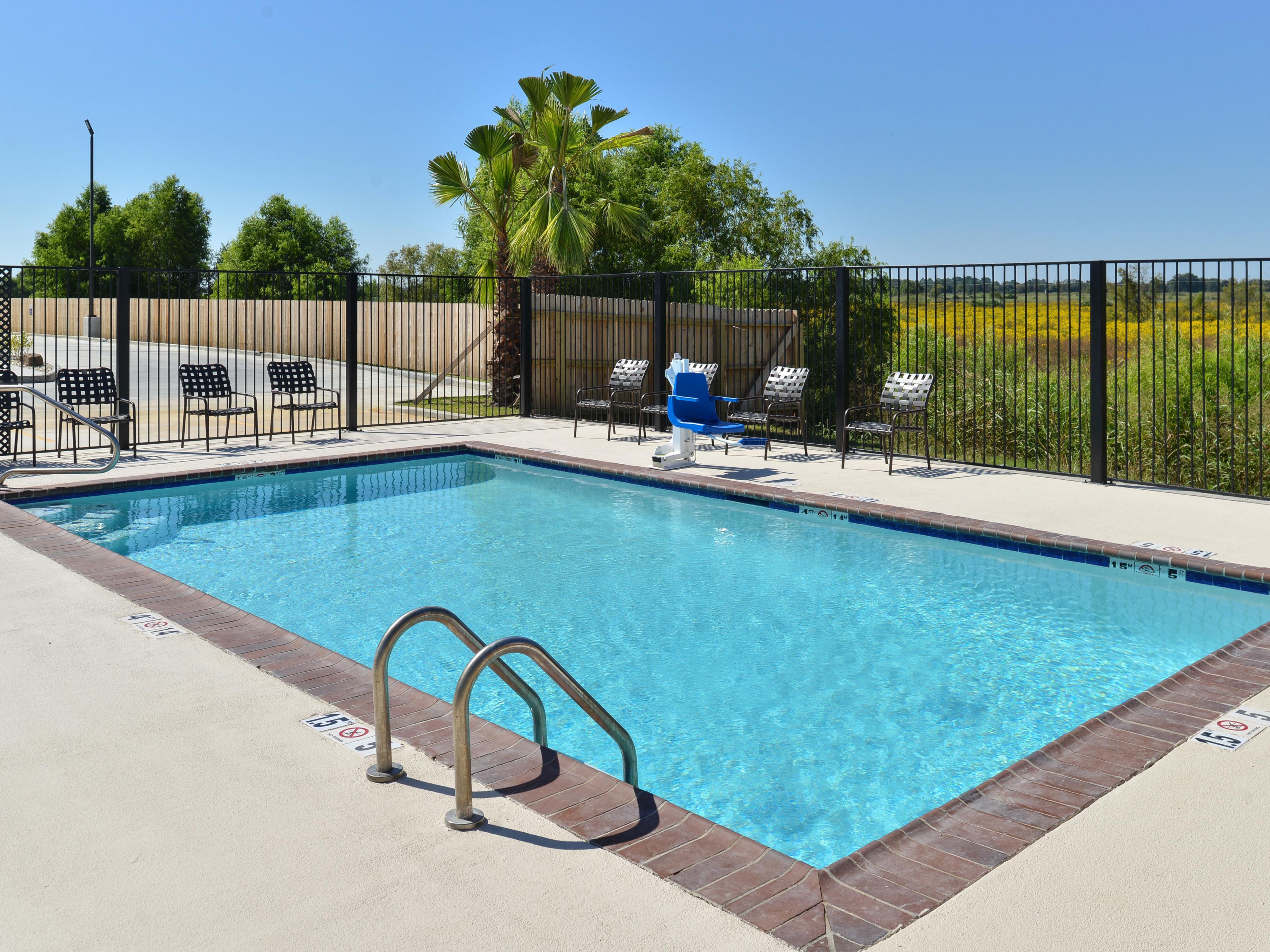 Candlewood Suites Houma Outdoor Swimming Pool and Lounge Chairs