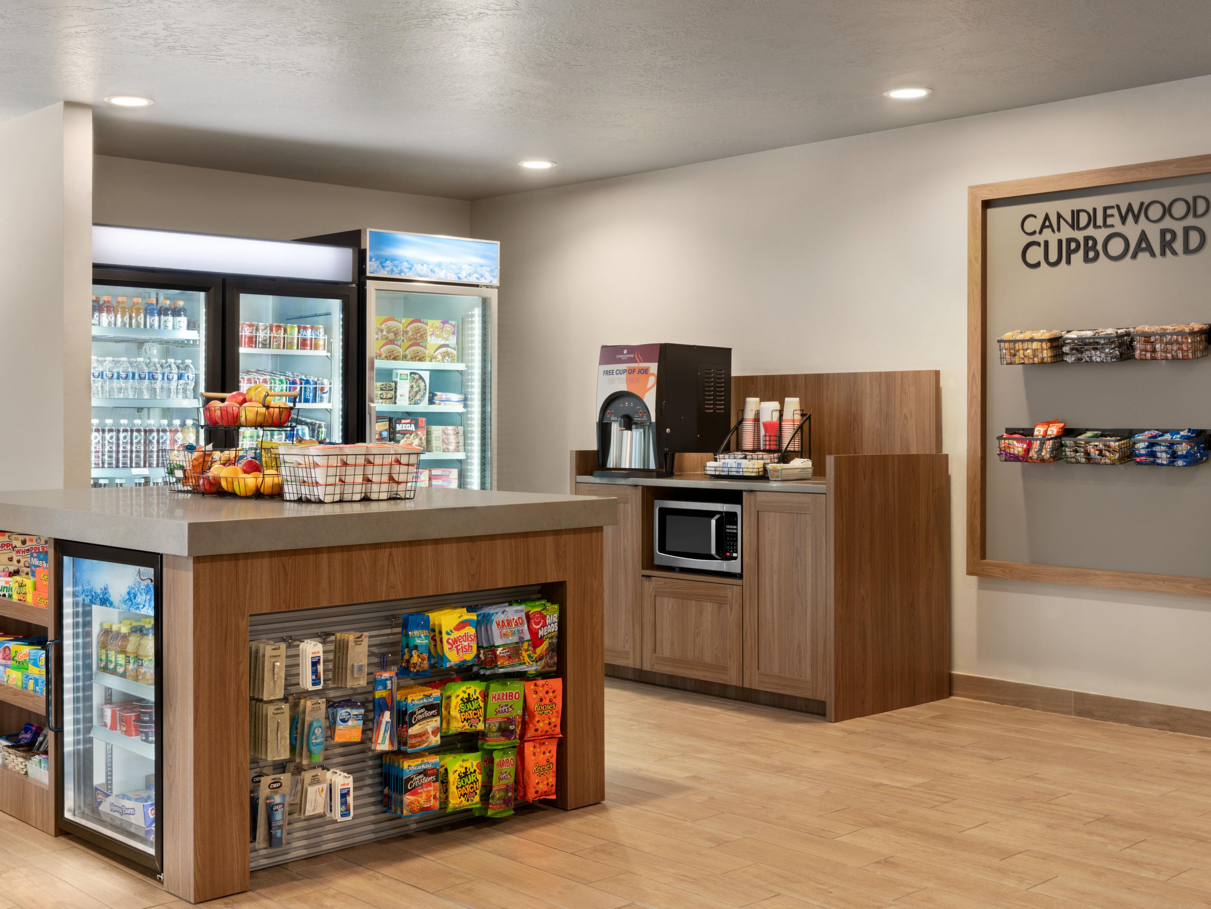 Explore offerings at the Candlewood Cupboard. From forgotten toiletries to late-night cravings, our Cupboard has you covered.  Whether you need a quick snack, breakfast, or a meal, our Cupboard ensures you have everything you need for a seamless and enjoyable stay. Welcome to convenience redefined