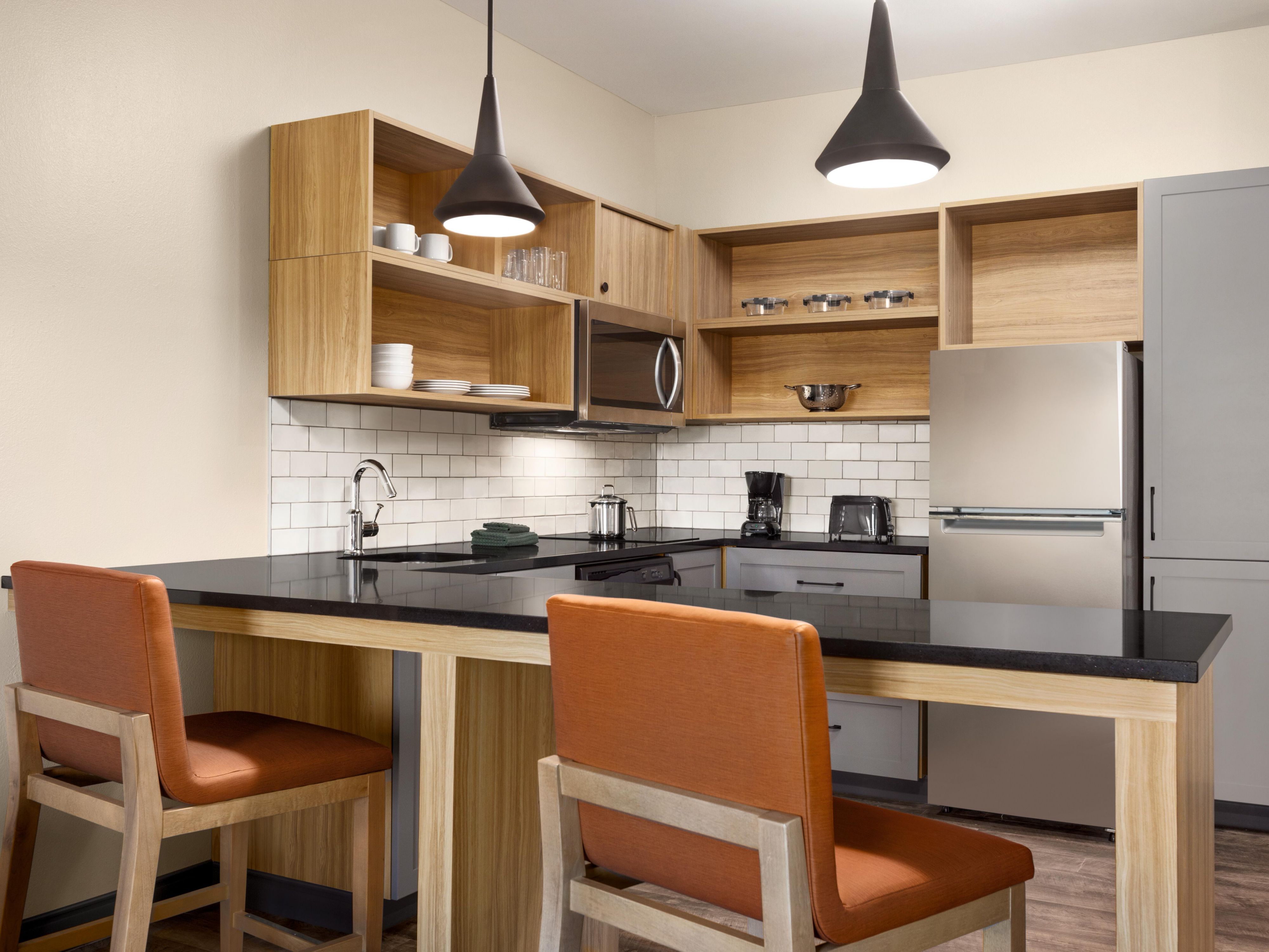 All suites have a fully equipped kitchen for your convenience including, a stove, full-size refrigerator, microwave, dishwasher, dining utensils and ample counter space.
