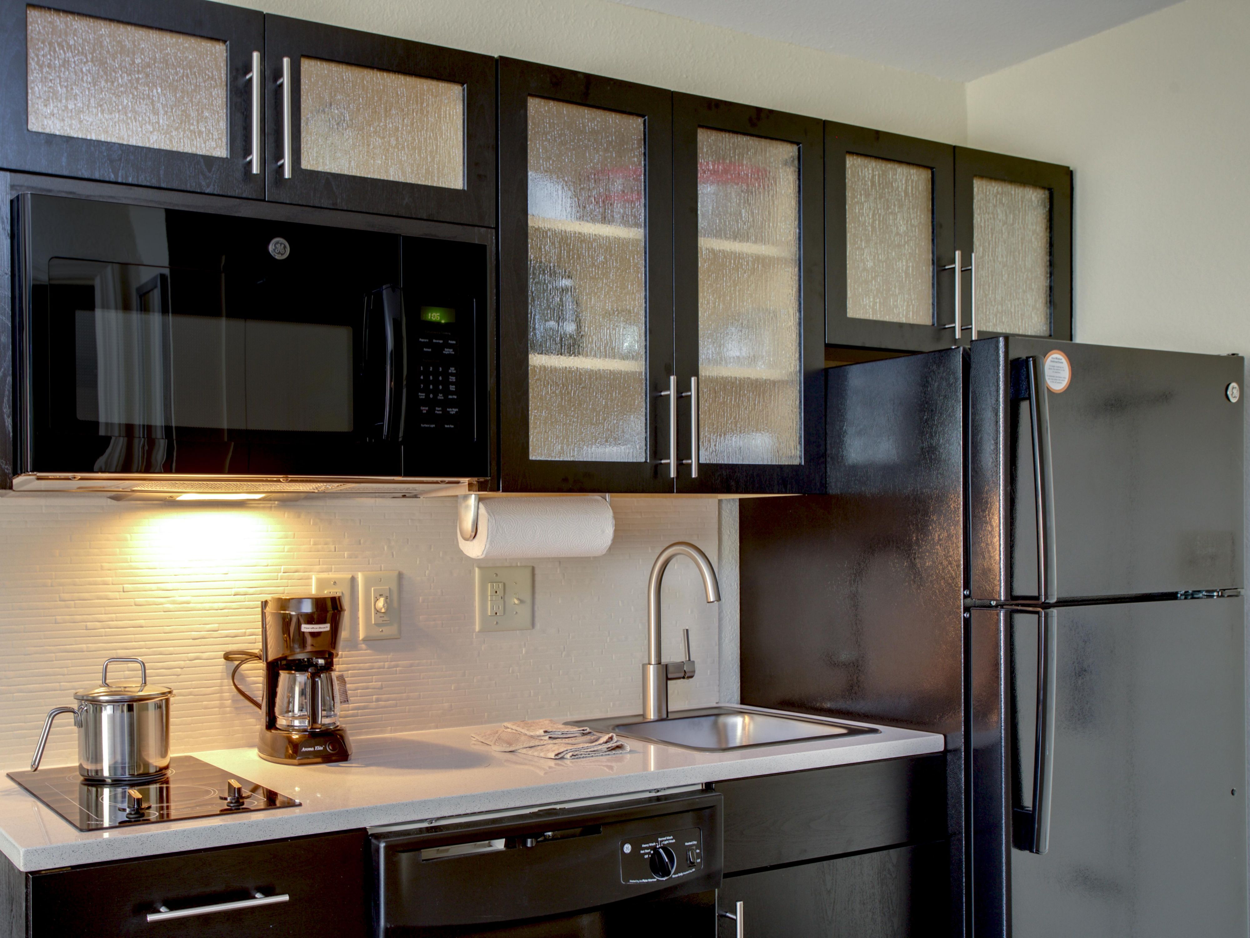 All guestrooms have fully equipped kitchens. 2 burner stove top, full sized refrigerator, dishwasher, microwave and coffeemaker. Kitchen is also supplied with all the plates, glasses, utensils, and cookware that you will need.