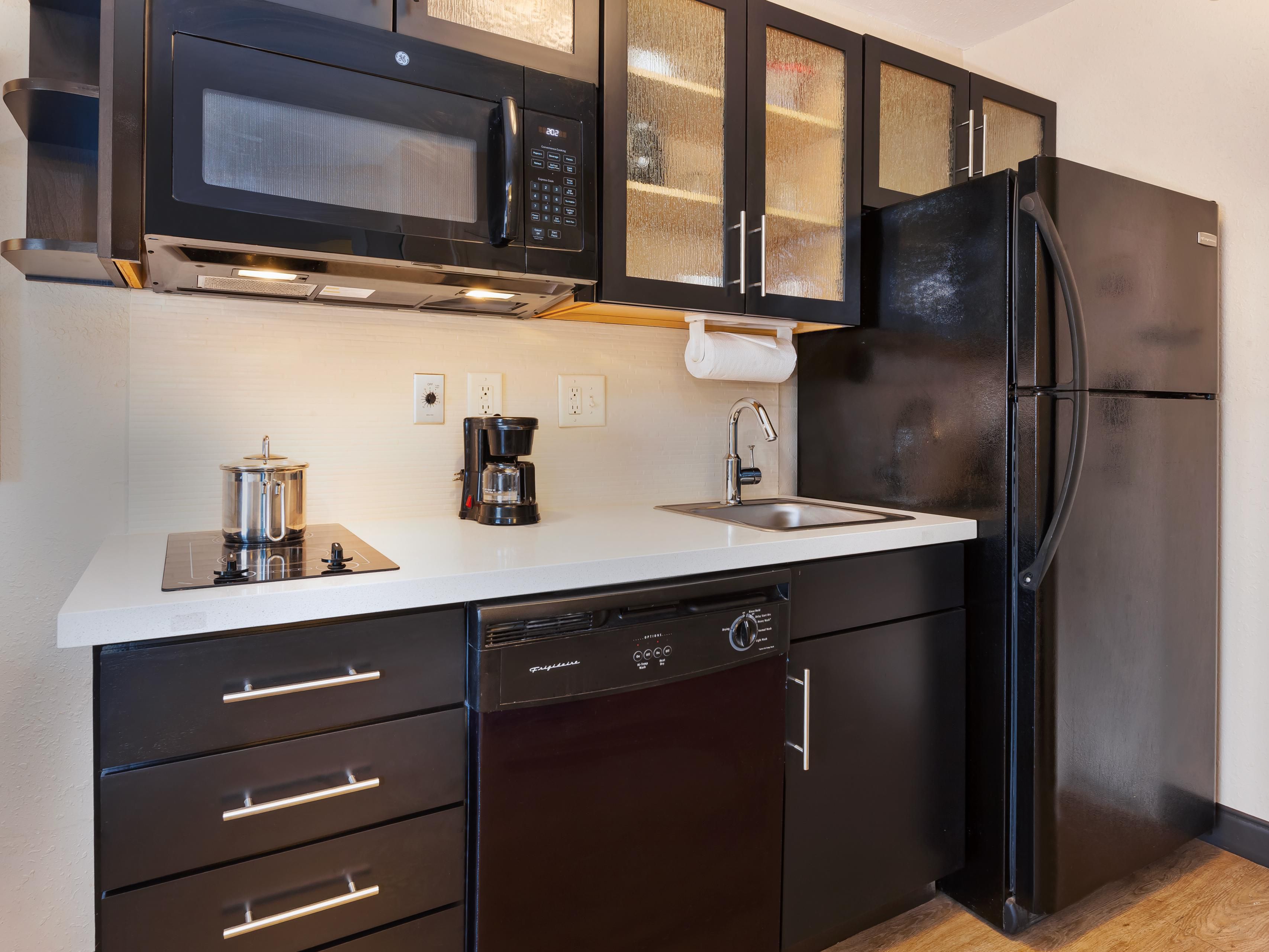 All guestrooms have fully equipped kitchens. Two burner stove top, full size refrigerator, dishwasher, microwave and coffee maker. Kitchen is also supplied with all the plates, utensils, and cookware that you will need.
