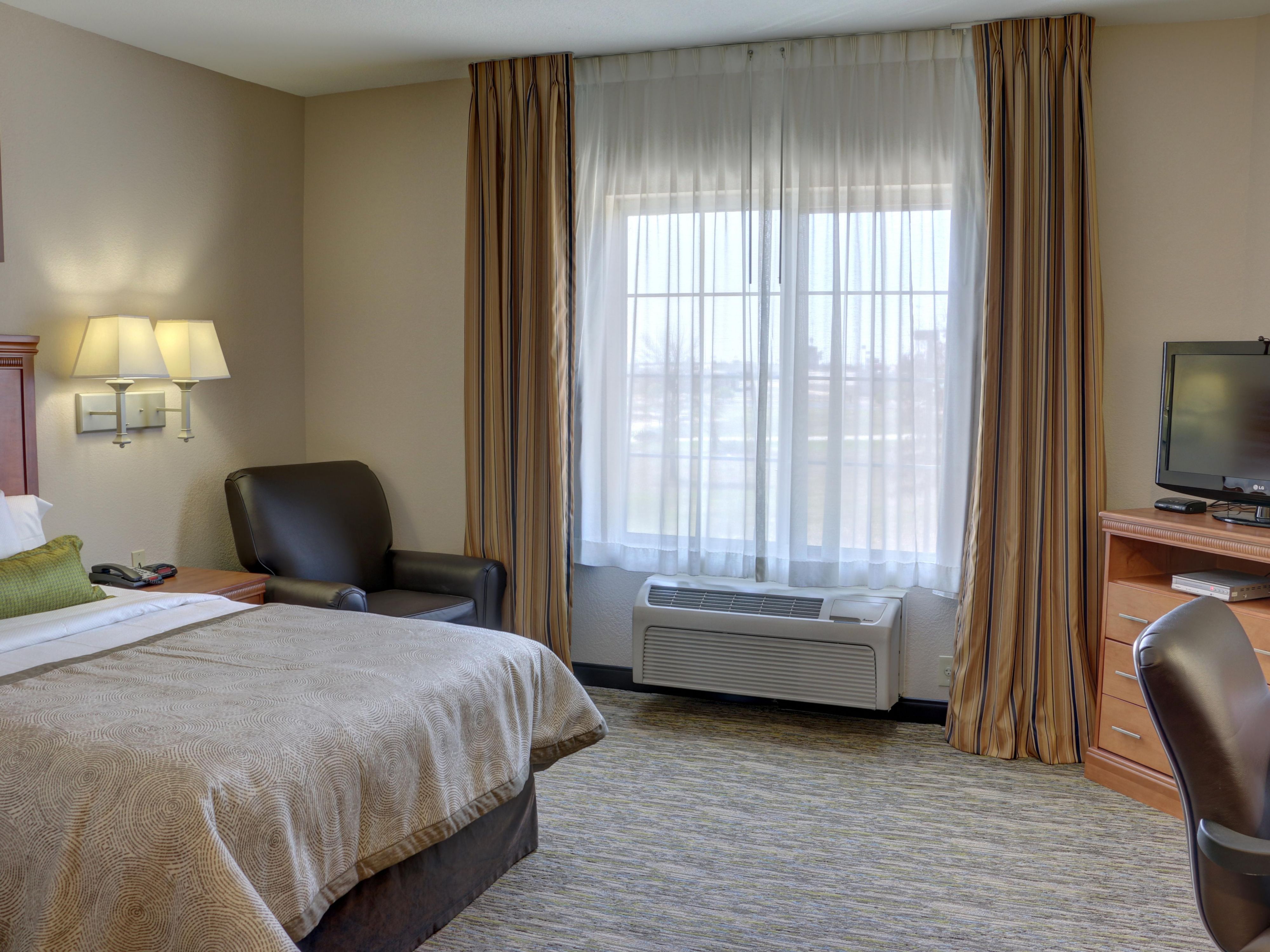 Studio Suite with full kitchen, desk recliner and dining area.