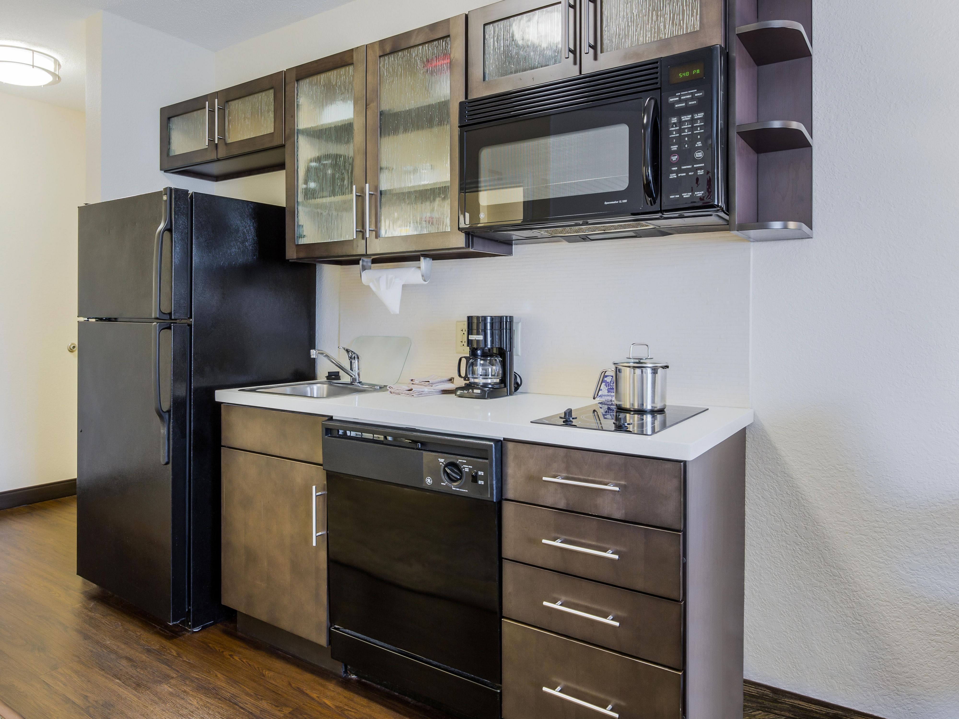 All guestrooms have fully equipped kitchens. 2 burner stove top, Full size refrigerator, dishwasher, microwave and coffee maker. The kitchen is also supplied with all the plates, utensils, and cookware that you will need.