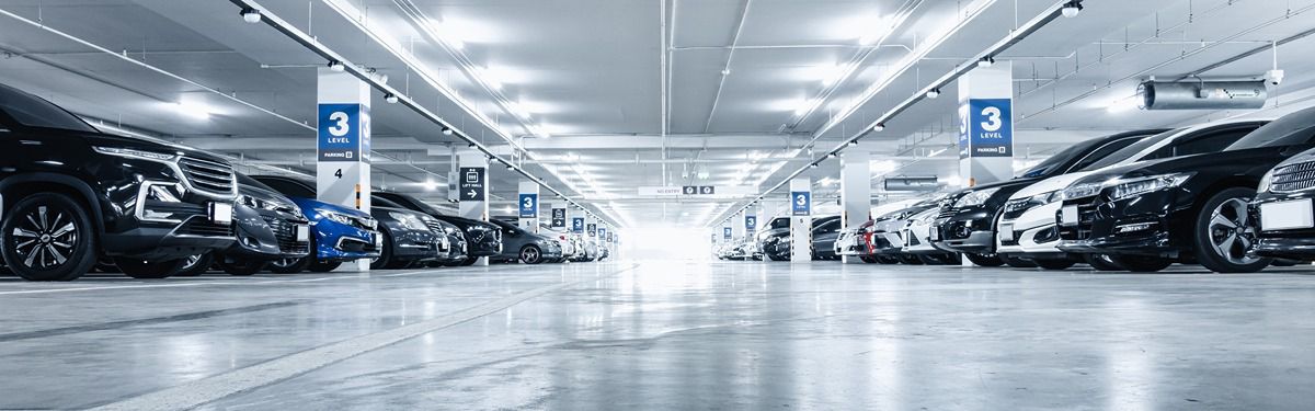 Spacious underground parking garage with parked vehicles