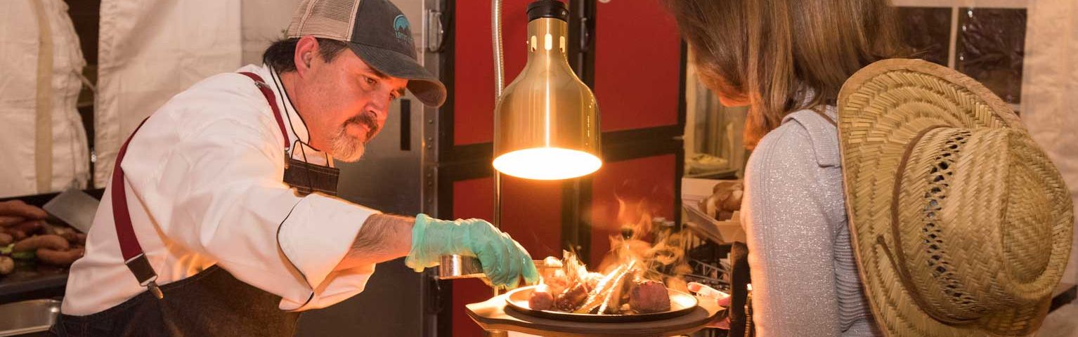 Employee serving guest catered meal at Holiday Inn Estes Park