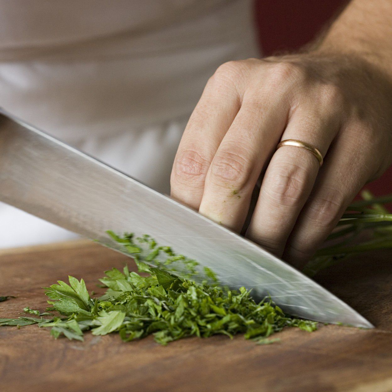Chef chopping parsley