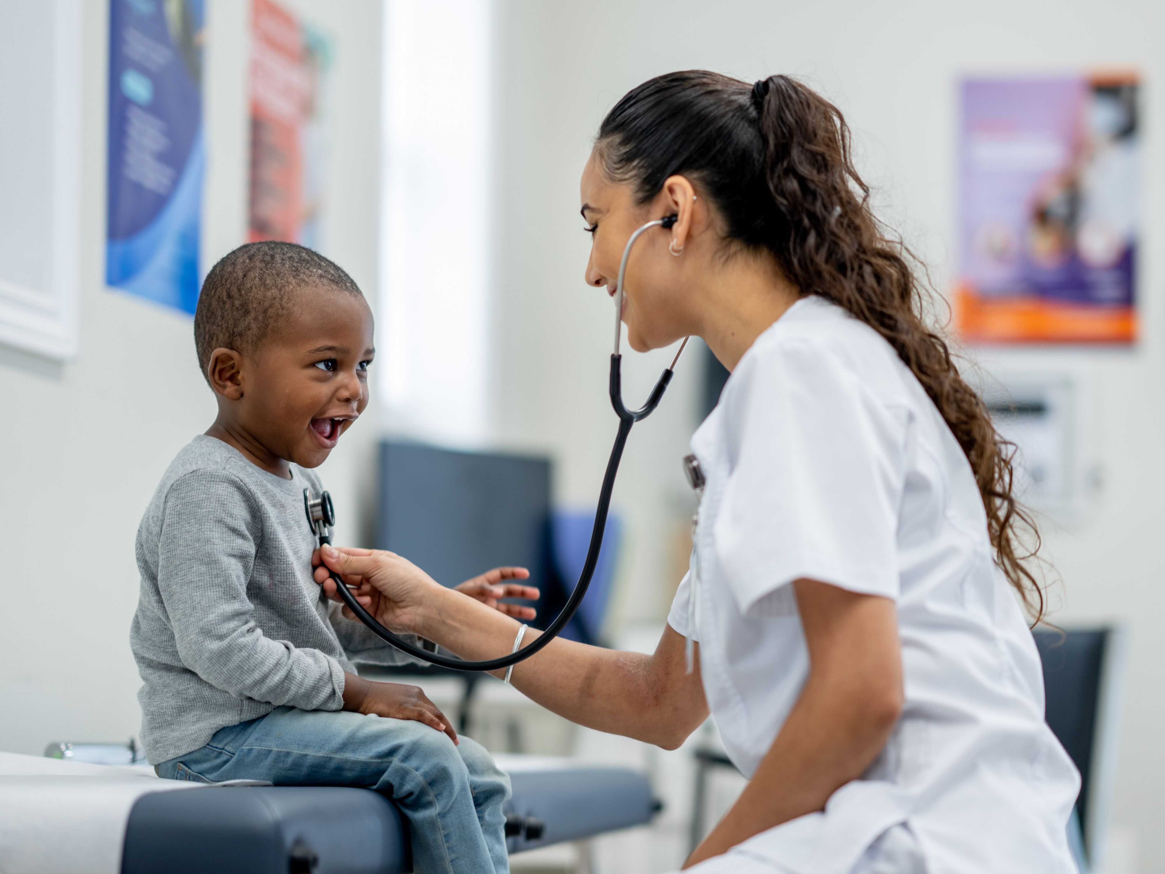 Doctor helping young child