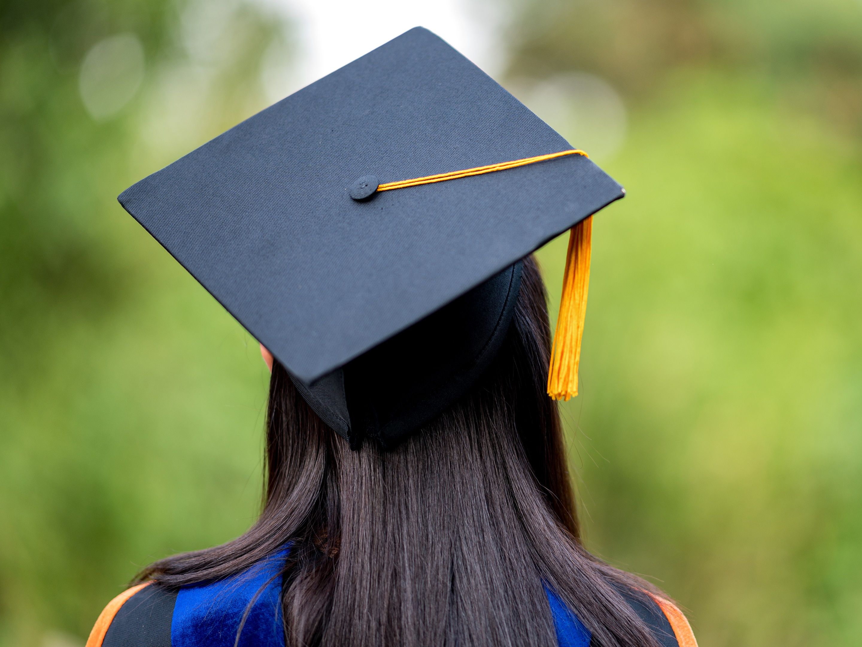 graduate in cap and gown