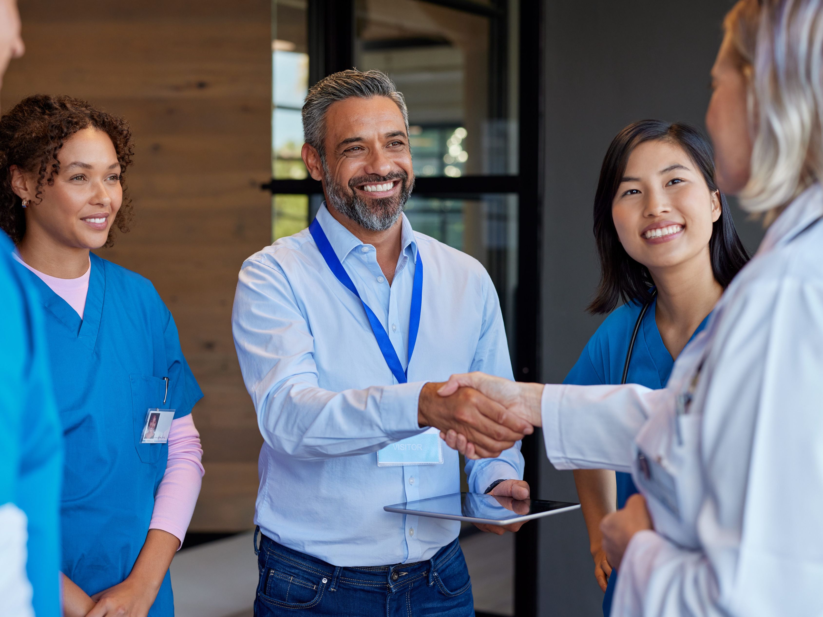 Medical professionals talking at a conference