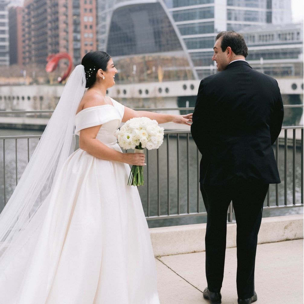Bride and groom outside of hotel
