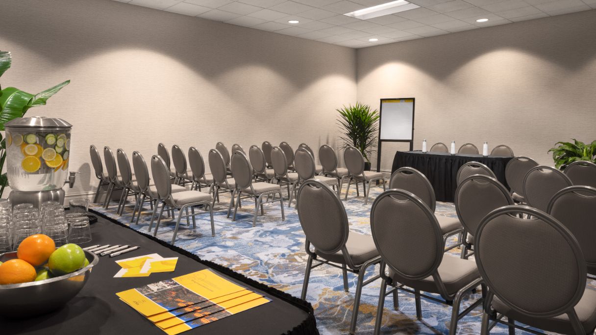 Classroom set up in conference room with table with infused water