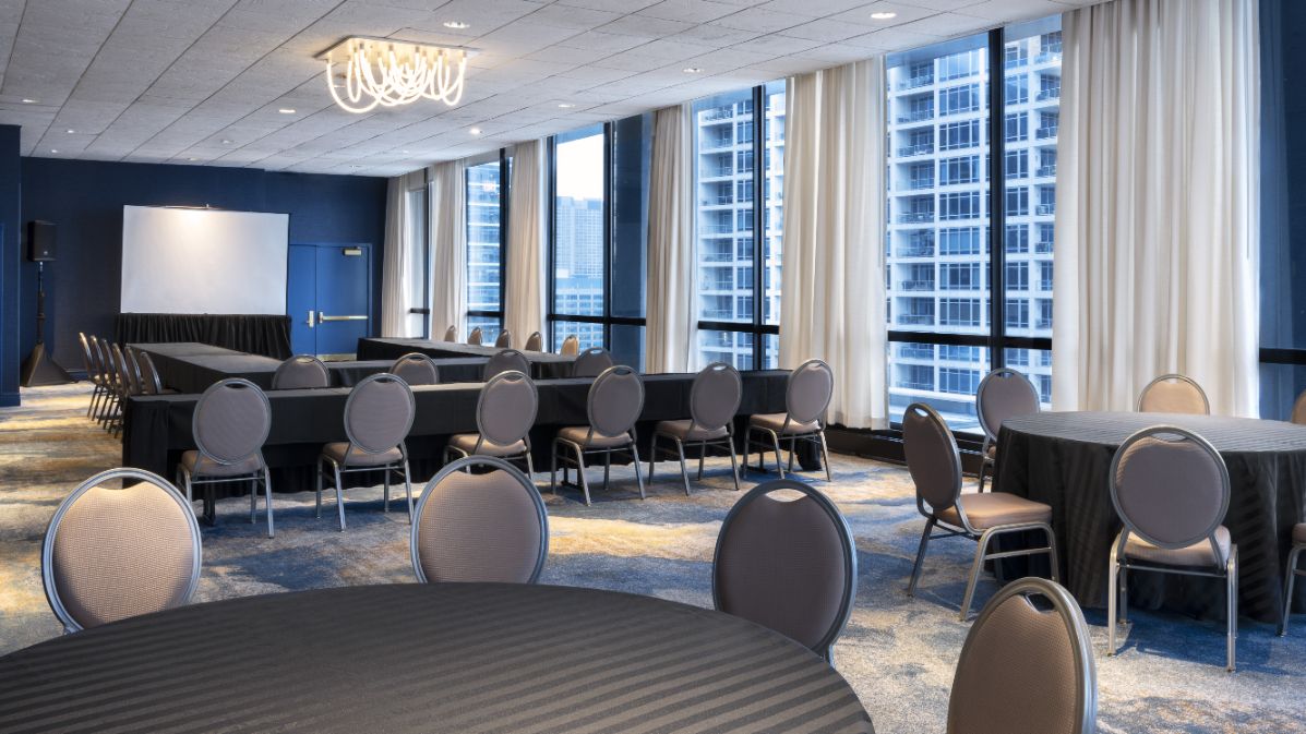 Large square table with conference phone in the center 