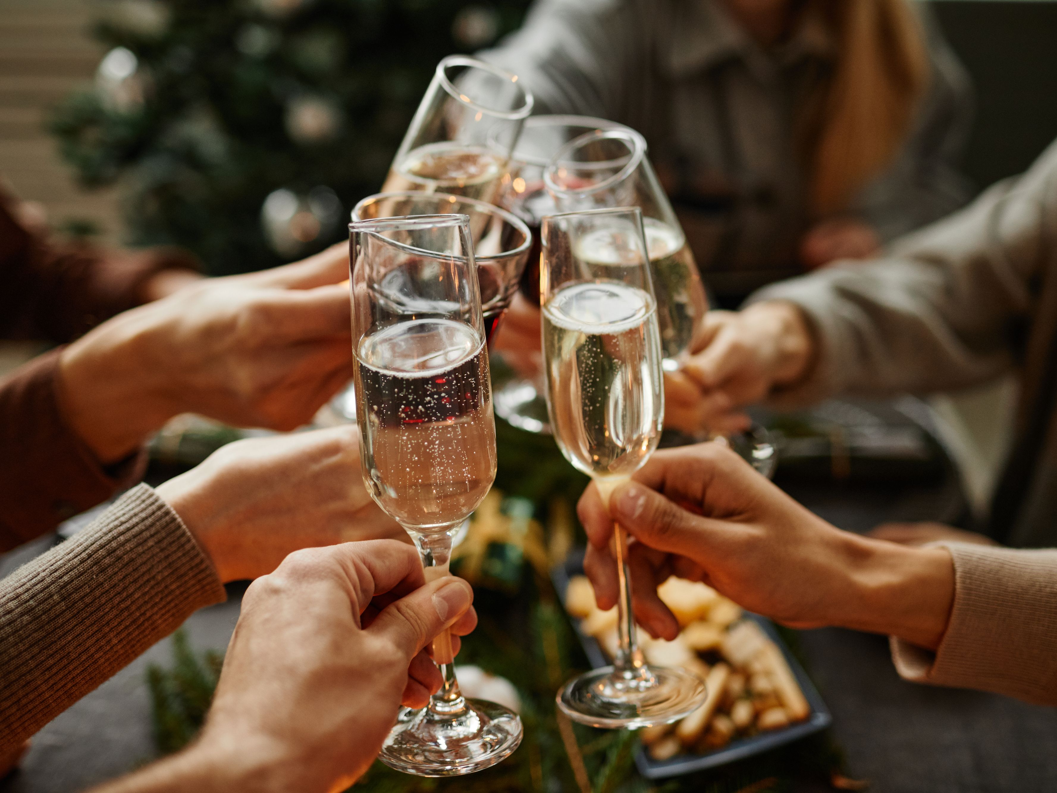 Champagne toast during Christmas gathering.