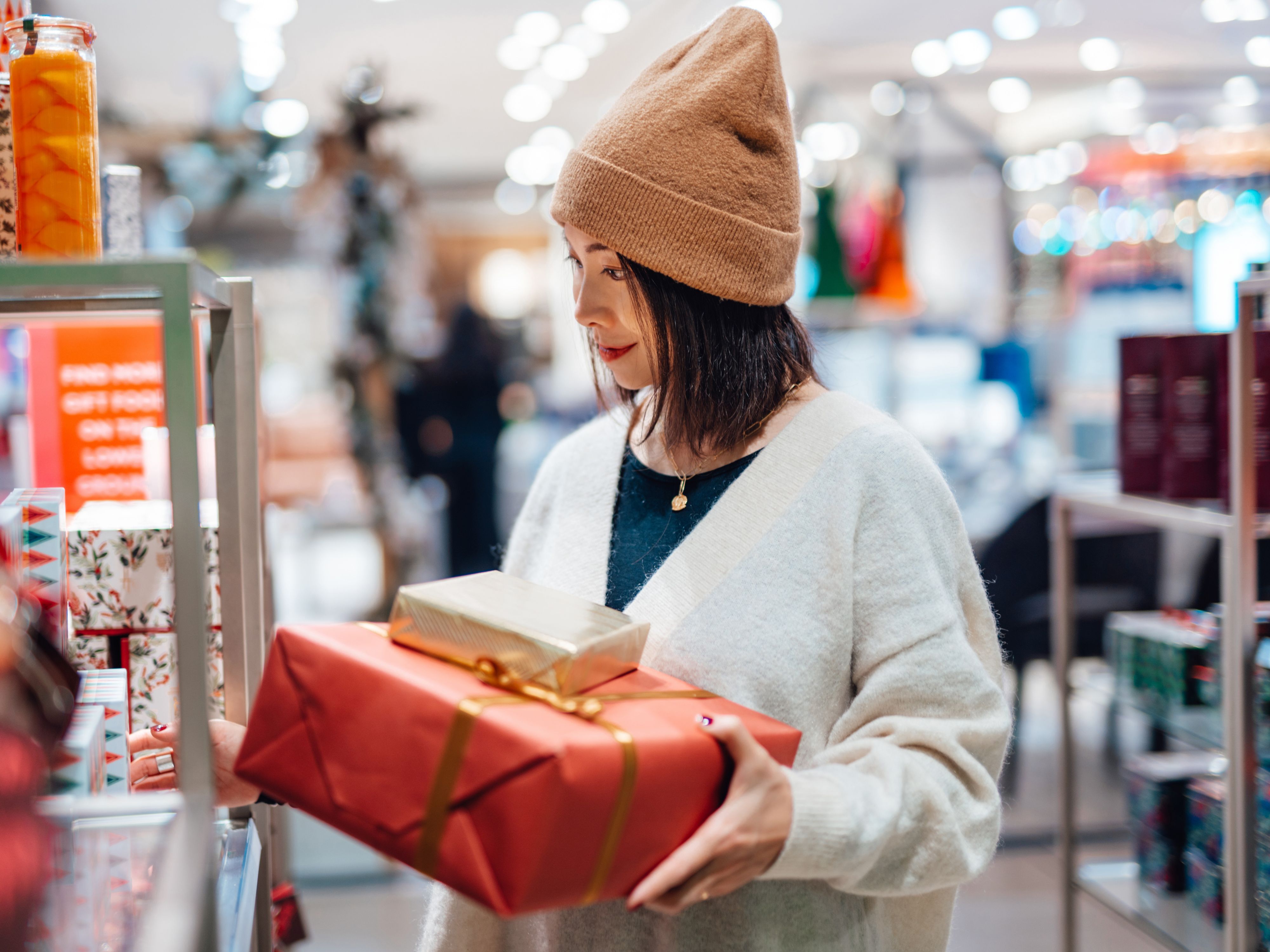 Woman holding presents shopping for gifts
