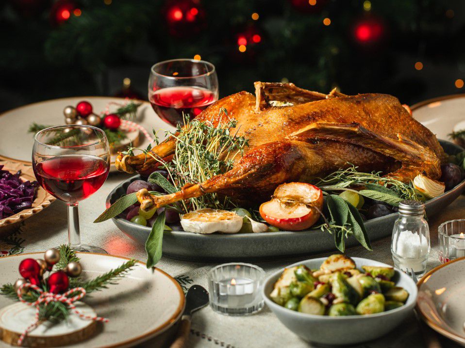 Dinner spread with turkey, vegetables, and side items 