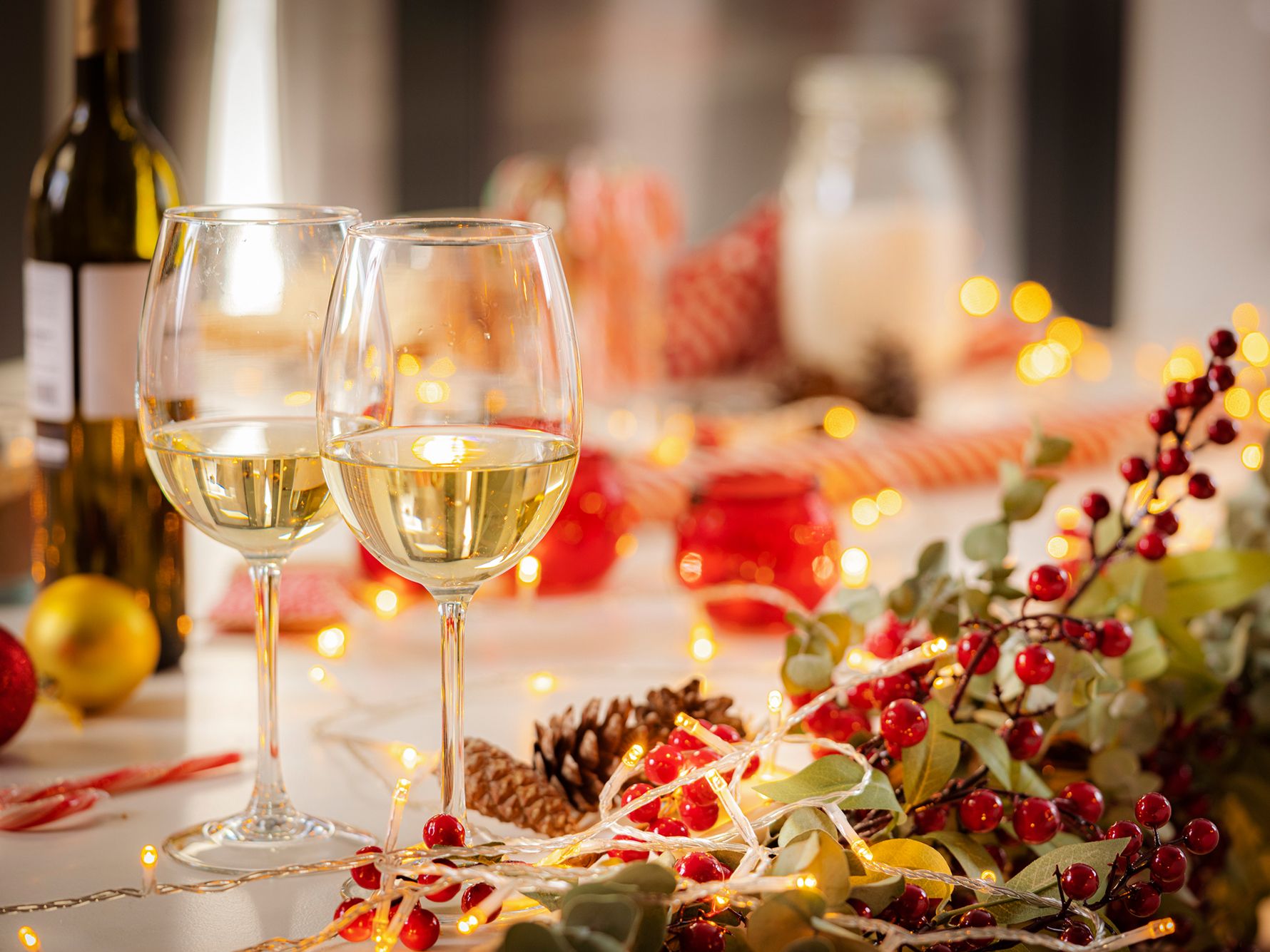 Glasses of white wine with Christmas decorations