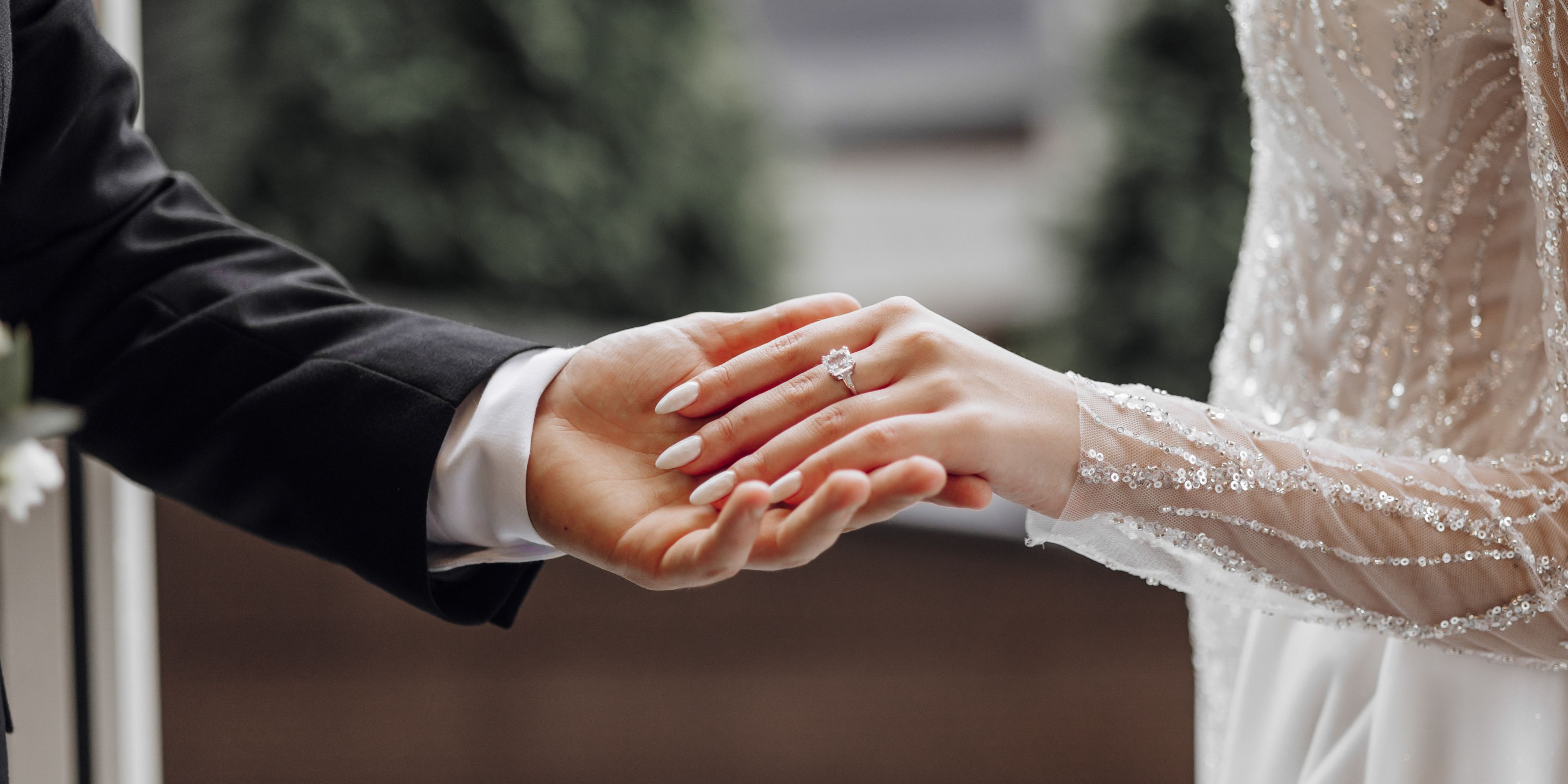 bride and groom holding hands