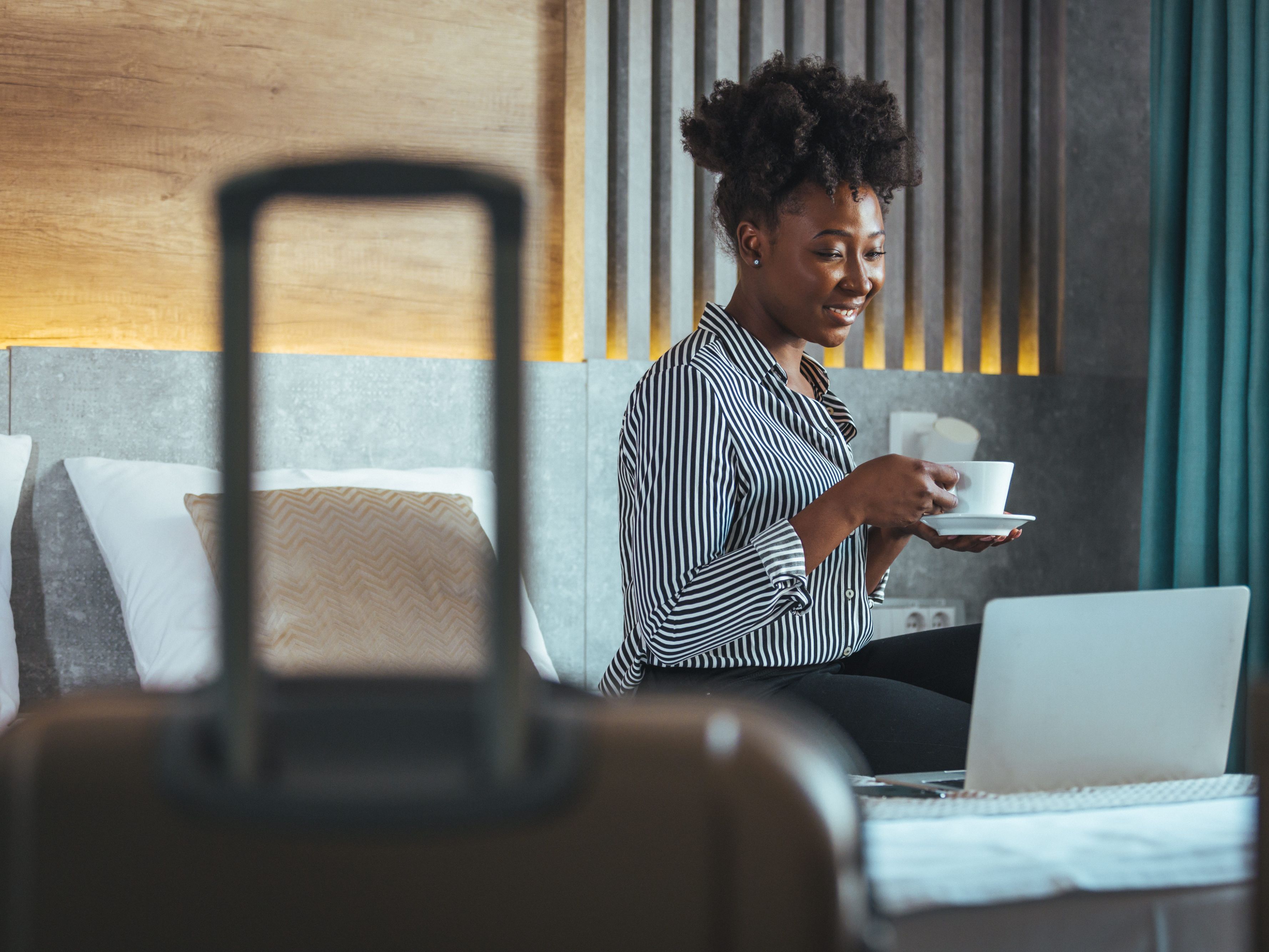 traveler drinking coffee in hotel