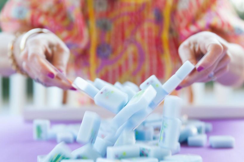 Woman playing mahjong.