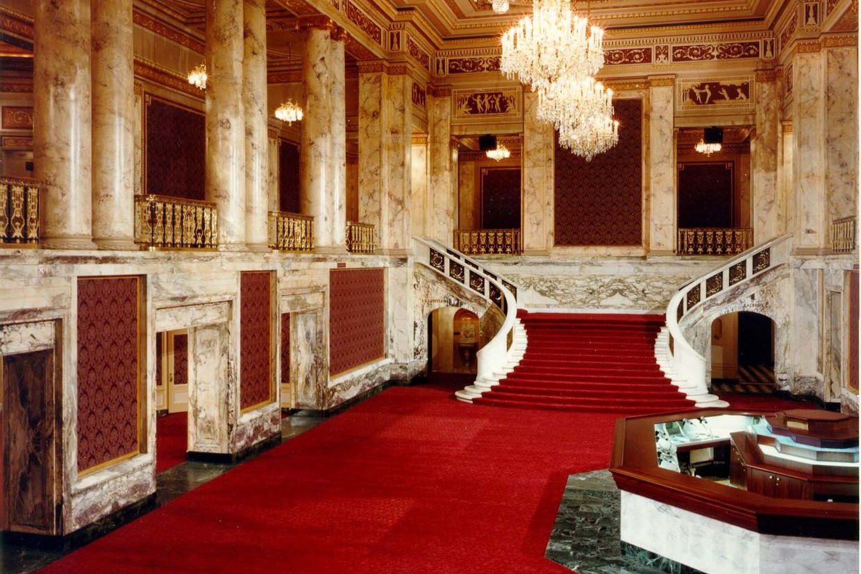 Grand staircase and chandeliers inside Palace Theatre.