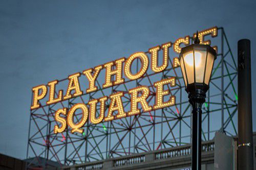 Playhouse Square sign illuminated in downtown Cleveland.