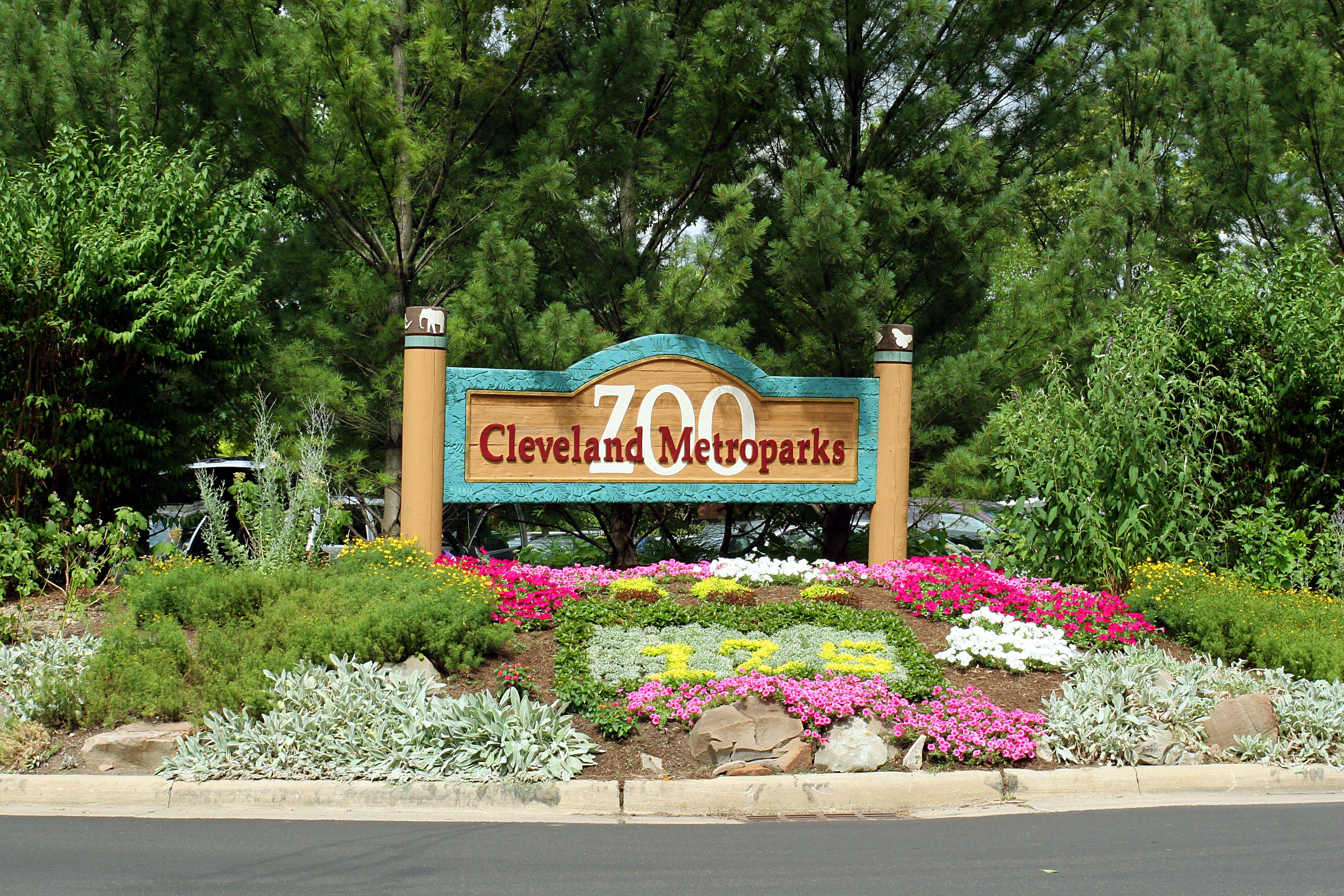 Entrance sign surrounded by flowers at Cleveland Metroparks Zoo.