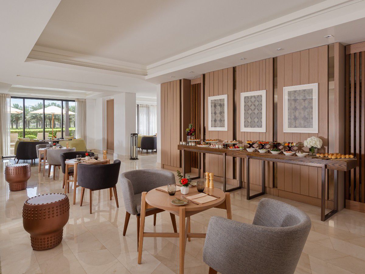 Club lounge with elegant seating and refreshment buffet