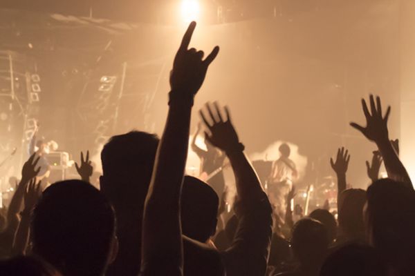 People at a concert with hands in the air