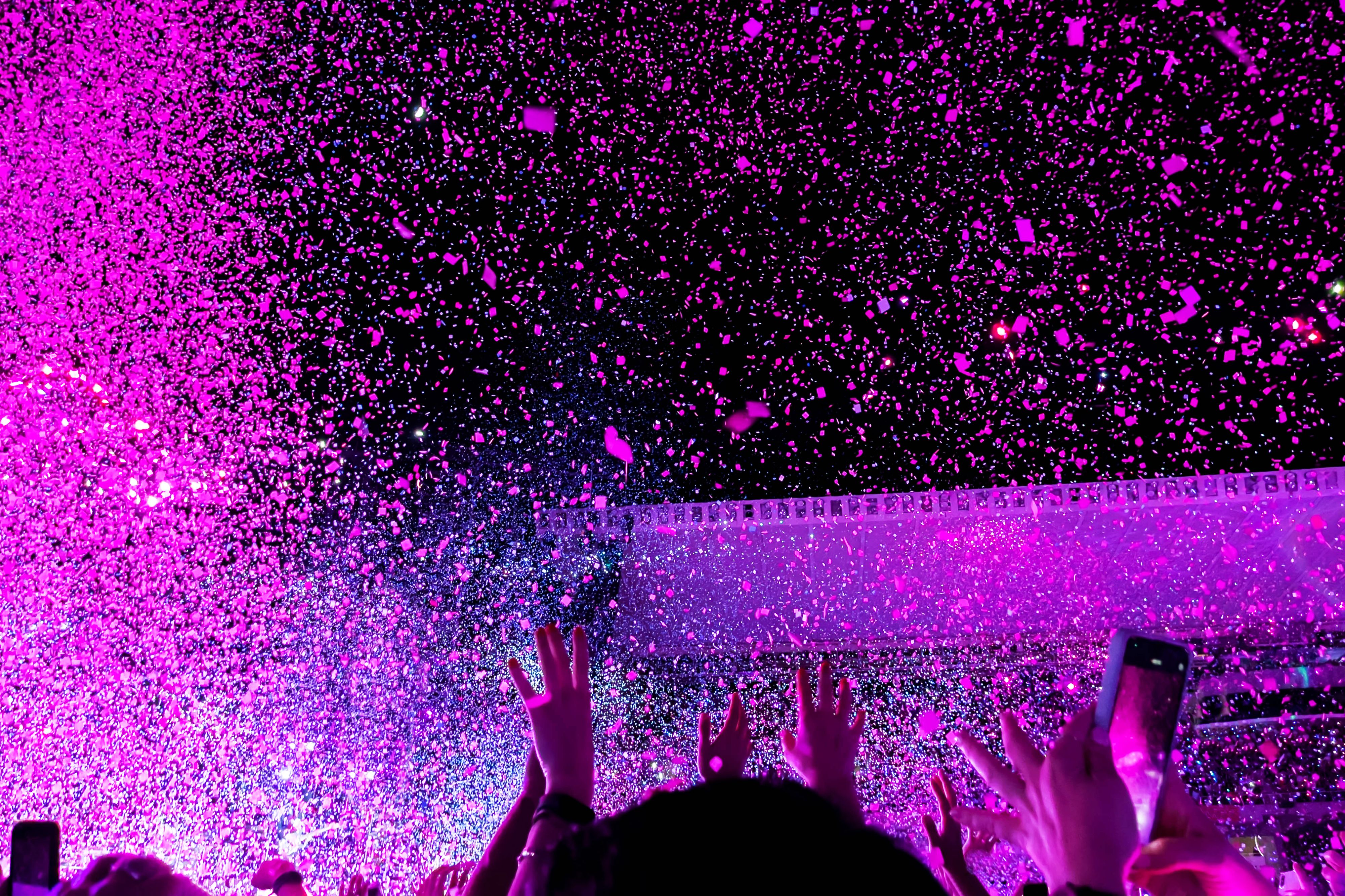 Pink confetti coming down at a concert.