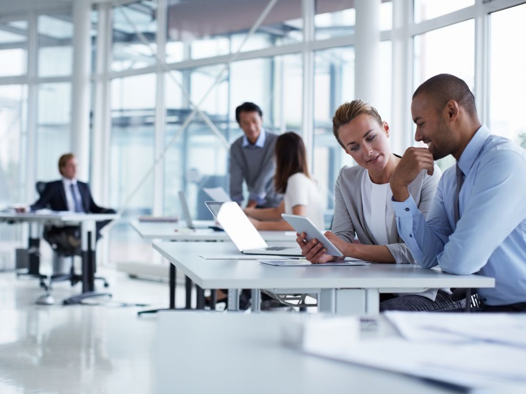 people discussing in a corporate office